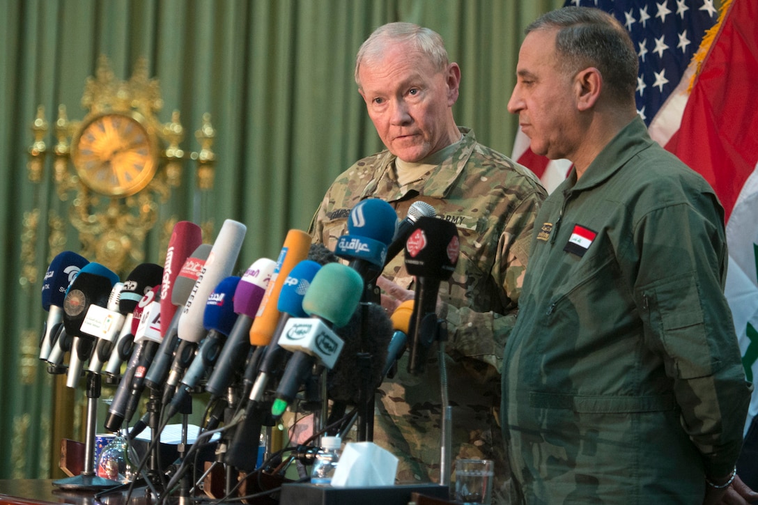 U.S. Army Gen. Martin E. Dempsey, chairman of the Joint Chiefs of Staff, and Iraqi Defense Minister Khaled al-Obeidi conduct a press conference in Baghdad, March 9, 2015. DoD photo by D. Myles Cullen