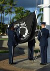 Airmen From Joint Base Pearl Harbor-Hickam’s Honor Guard raise the POW/MIA flag during a POW/MIA reveille ceremony, held on JBPHH, Hawaii, Sept. 14, 2015. The ceremony started this year’s POW/MIA week, which honors the 1,627 missing or unaccounted for military members in all branches of armed services. The POW/MIA flag symbolizes the nation’s remembrance of those who were imprisoned while serving in conflicts and those who remain missing. (U.S. Air Force photo by Tech. Sgt. Aaron Oelrich/Released)