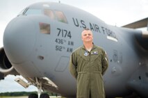 Col. D. Scott Durham, 512th Airlift Wing commander, stands in front a Team Dover C-17 Globemaster III, Sept. 13, on Dover Air Force Base, Delaware. Durham, a South Carolina native, has more than 4,900 of flight hours under his belt operating both C-5 and C-17 aircraft. (U.S. Air Force photo by 1st Lt. Steve Lewis)