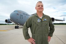 Col. D. Scott Durham, 512th Airlift Wing commander, stands in front a Team Dover C-17 Globemaster III, Sept. 13, on Dover Air Force Base, Delaware. Durham, a South Carolina native, has more than 4,900 of flight hours under his belt operating both C-5 and C-17 aircraft. (U.S. Air Force photo by 1st Lt. Steve Lewis)