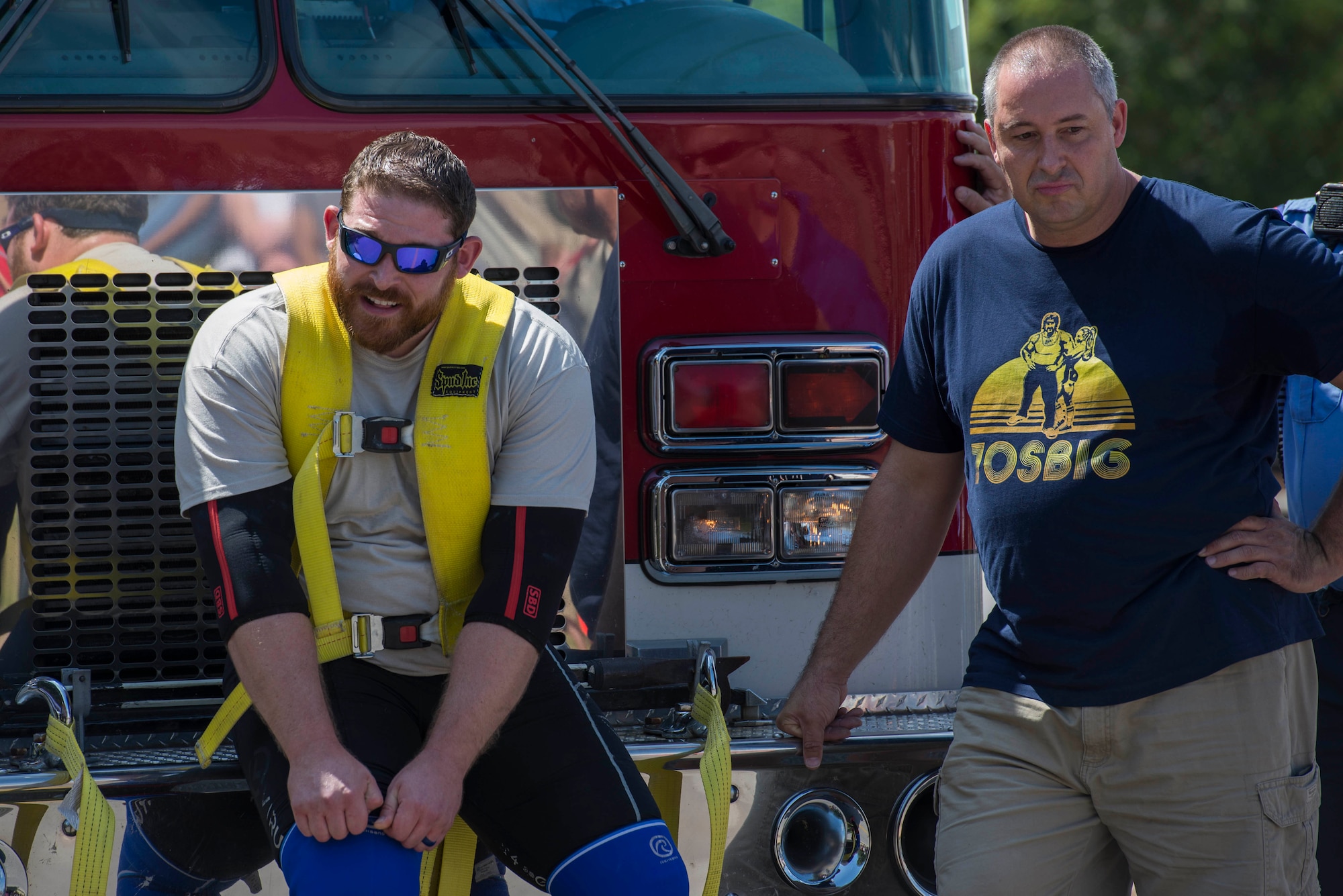 Mike Battaglino rests after pulling a Wichita Falls fire truck on Sheppard Air Force Base, Texas, Sept. 12, 2015. Battaglino vowed to pull the truck once for every 500 dollars raised, up to three times, to raise money for retired U.S. Air Force Col. Shawn “Norm” Pederson who suffered an aneurism shortly after retiring. (U.S. Air Force photo by Senior Airman Kyle Gese/Released)