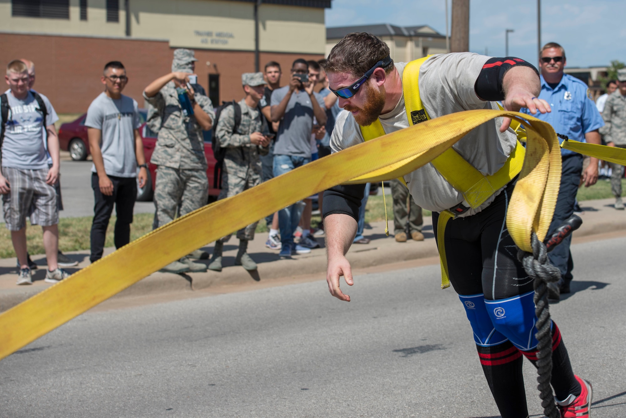 Mike Battaglino finishes pulling a Wichita Falls fire truck on Sheppard Air Force Base, Texas, Sept. 12, 2015. Battaglino pulled the truck to raise money for retired U.S. Air Force Col. Shawn “Norm” Pederson who suffered an aneurism shortly after retiring. He was Pederson’s dedicated crew chief during his time as an active duty pilot. (U.S. Air Force photo by Senior Airman Kyle Gese/Released)
