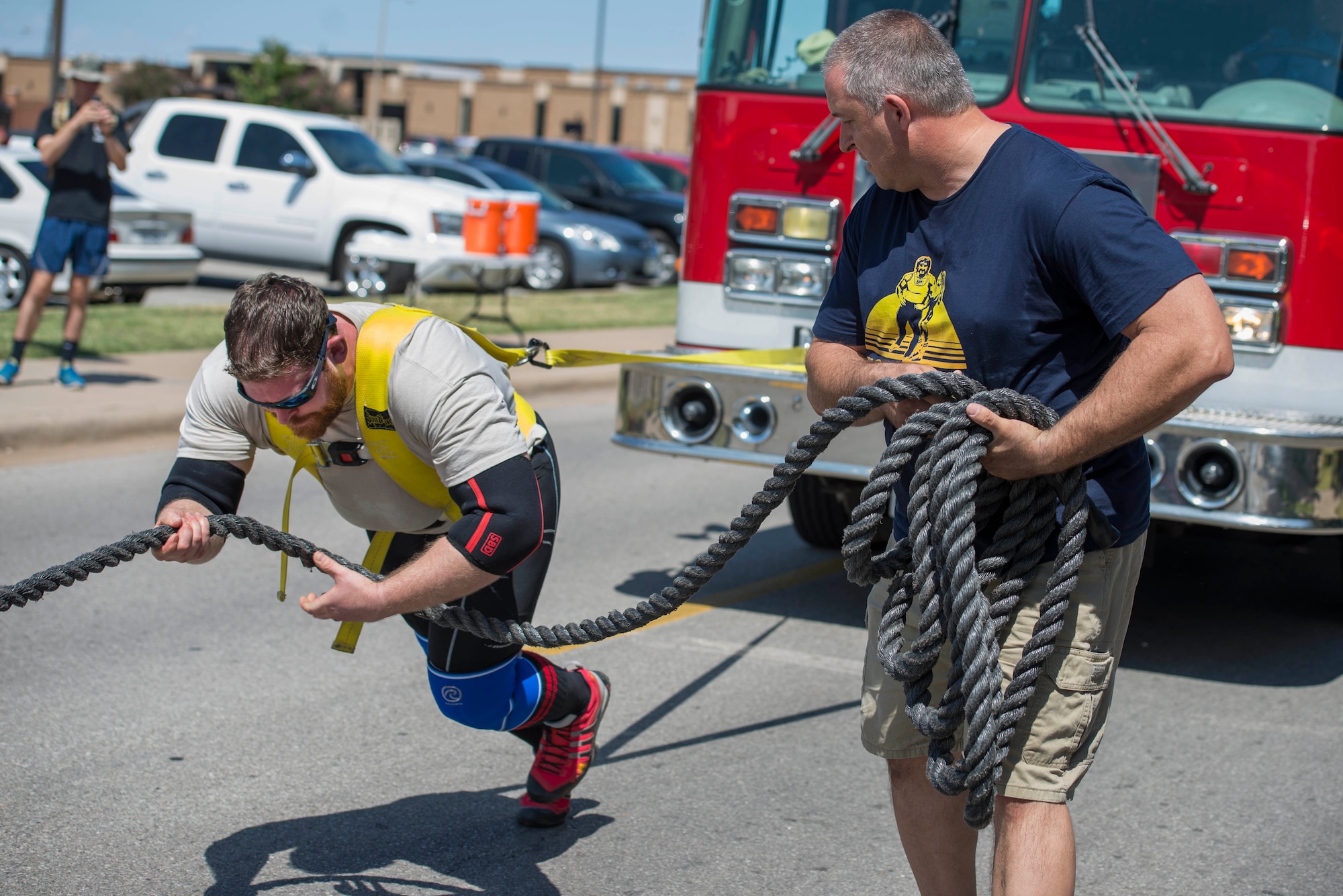 Mike Battaglino pulls a Wichita Falls fire truck on Sheppard Air Force Base, Texas, Sept. 12, 2015. Battaglino pulled the truck after hearing the news that his former mentor, retired U.S. Air Force Col. Shawn “Norm” Pederson, suffered from an aneurism, he stepped up to help his family raise money for the medical care. (U.S. Air Force photo by Senior Airman Kyle Gese/Released)