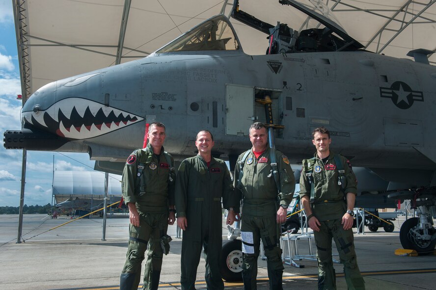 U.S. Air Force Col. James Travis, 476th Fighter Group commander, poses for a photo with members of his flight formation in front of an A-10C Thunderbolt II after his fini-flight Sept. 11, 2015, at Moody Air Force Base, Ga. The final flight, also known as a “fini-flight,” has been a tradition for departing or retiring pilots or commanders since the Vietnam War. (U.S. Air Force photo by Airman 1st Class Kathleen D. Bryant/Released)