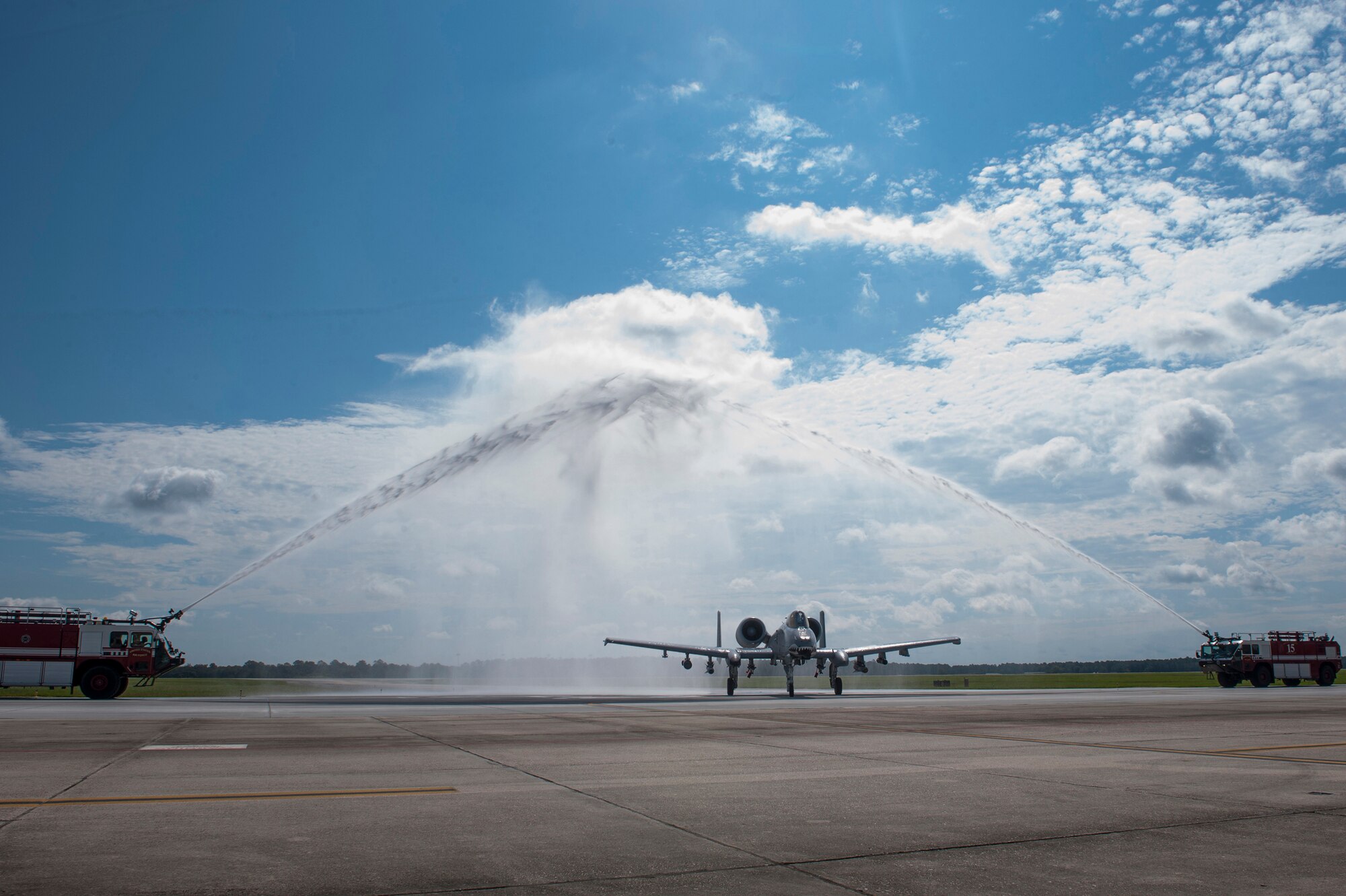 U.S. Air Force Col. James Travis, 476th Fighter Group commander, taxis from the runway Sept. 11, 2015, at Moody Air Force Base, Ga. Taxiing underneath streams of water is a part of the long standing tradition at the end of a pilot’s fini-flight. (U.S. Air Force photo by Airman 1st Class Kathleen D. Bryant/Released)