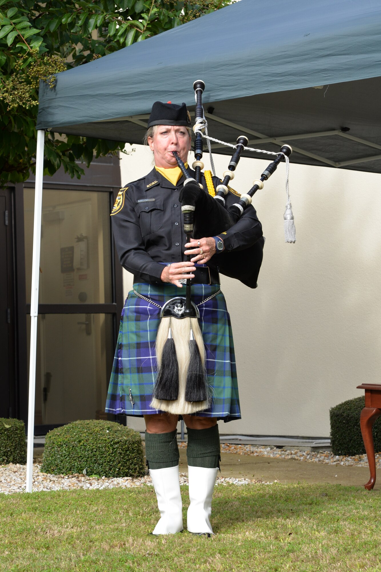 Deputy Kathy McCurdy of the Bay County Sherriff’s Office plays “Amazing Grace” during the 9/11 remembrance ceremony at the 601st Air Operations Center Sept. 11. The ceremony was held to honor and remember all who were affected by the tragic events of that day. (Air Force photo released/Capt. Jared Scott)