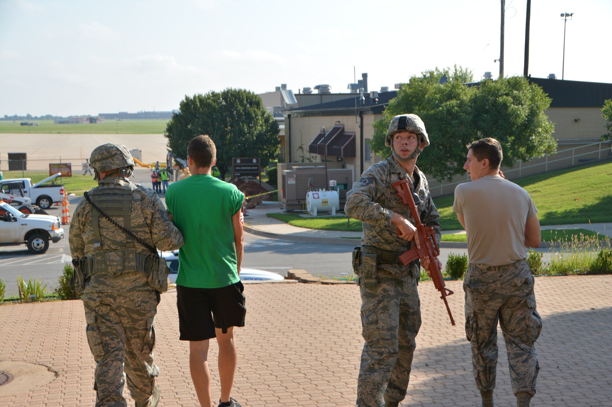 72nd Security Forces Squadron Airmen escort mock victims to safety during an active shooter exercise Aug. 11, 2015, at Tinker Air Force Base, Okla. This is the
third active shooter exercise performed on Tinker Air Force Base this year. (U.S. Air Force photo by Tech. Sgt. Lauren Gleason)
