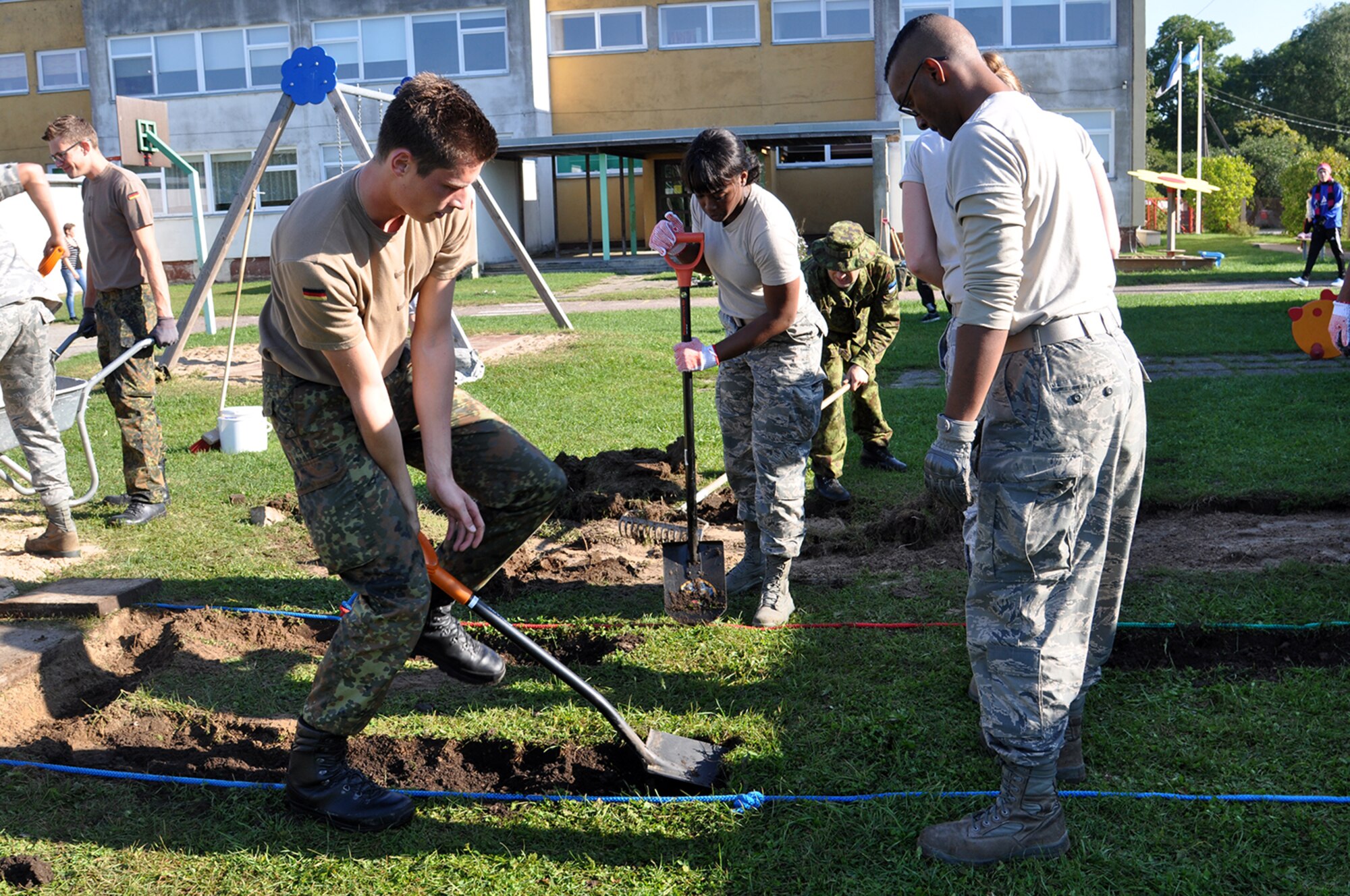 Reservists from the 442d Fighter Wing work with the Estonian and German military, and local community members to repair and construct new activities at a local elementary school outside of Amari Air Base in Estonia Sept. 12. The Airmen are here supporting Operation Atlantic Resolve and gave a one of the few days off they had to participate in the community service project. (U.S. Air Force photo by Capt. Denise Haeussler)