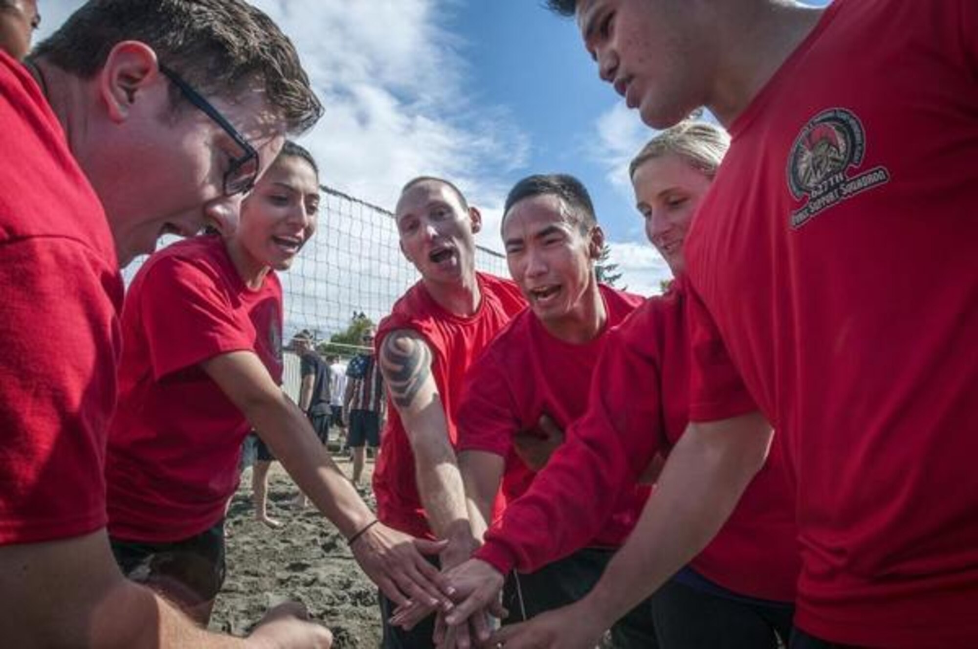 627th FSS teammates prepare to take the court for their volleyball match with 5th ASOS Team 3 Sept. 3 during McChord Sports Day on McChord Field. (Northwest Guardian/courtesy photo)