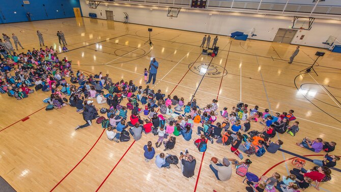 Shaquille O’Neal, former professional basketball player, speaks to children at McAdoo Fitness Center at Minot Air Force Base, N.D., September 8, 2015. As a part of their base visit O’Neal, Dale Brown, former college basketball coach, and Kevin Cramer, congressman, toured a B-52H Stratofortress, the Uniform 1 missile training facility, McAdoo Fitness Center, the base theater and Rockers Bar and Grill to meet with Minot personnel and families. (U.S. Air Force photo/ Airman 1st Class Justin T. Armstrong) 
