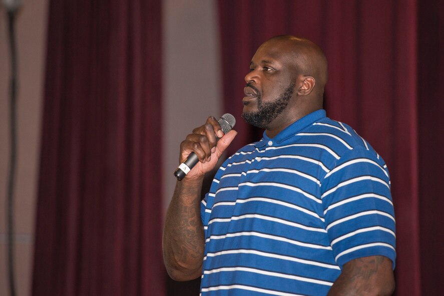 Shaquille O’Neil, former professional basketball player, speaks to Airmen at the base theater at Minot Air Force Base, N.D., September 8, 2015. O’Neil and Dale Brown, former college basketball coach, spoke to Airmen at the base theater about overcoming challenges in life and the true meaning of being successful. (U.S. Air Force photo/ Airman 1st Class Justin T. Armstrong)