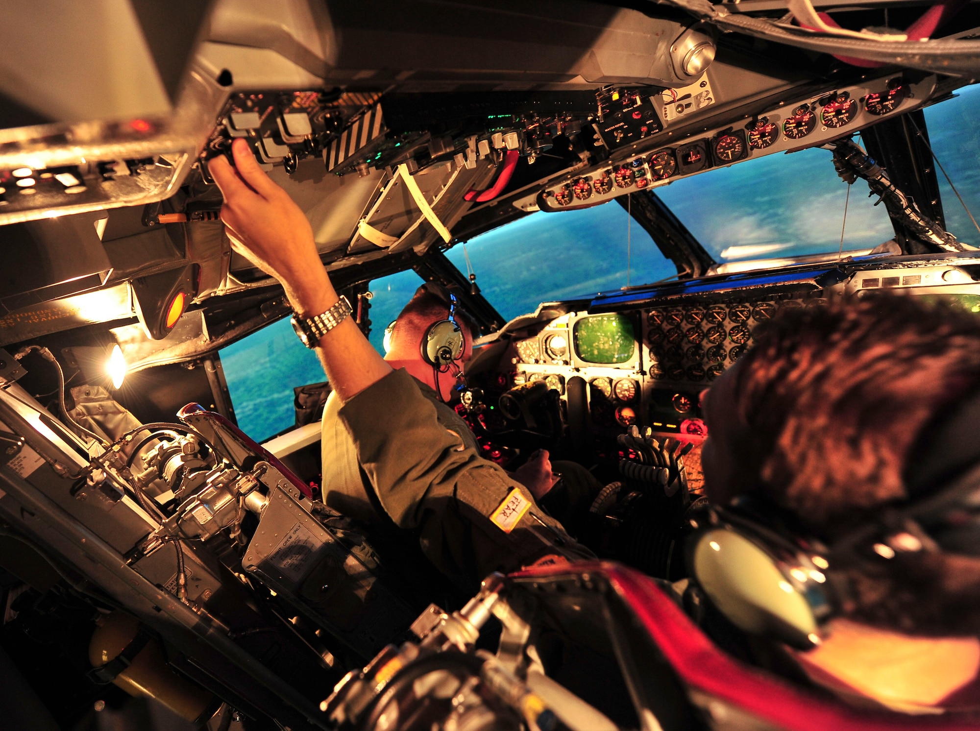 Members of the 69th Bomb Squadron practice in the weapons system trainer at Minot Air Force Base, N.D., Sept. 8, 2015. The WST offers the most realistic method available for training and evaluating B-52H Stratofortress crew members. (U.S. Air Force photo/Senior Airman Stephanie Morris)
