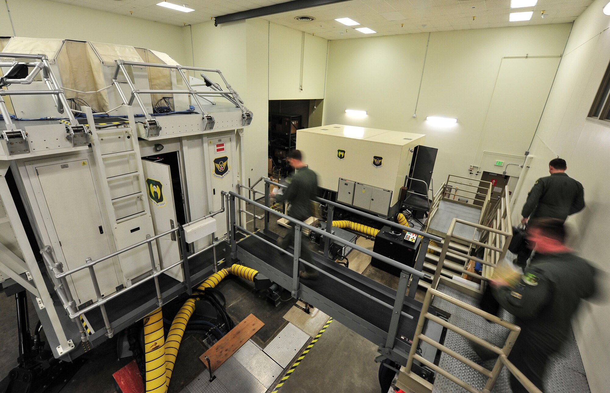 Members of the 69th Bomb Squadron enter the weapons system trainer at Minot Air Force Base, N.D., Sept. 8, 2015. The 69th BS is preparing to participate in Air Force Global Strike Command’s Global Strike Challenge, the world's premier bomber, intercontinental ballistic missile, helicopter and security forces competition. (U.S. Air Force photo/Senior Airman Stephanie Morris)