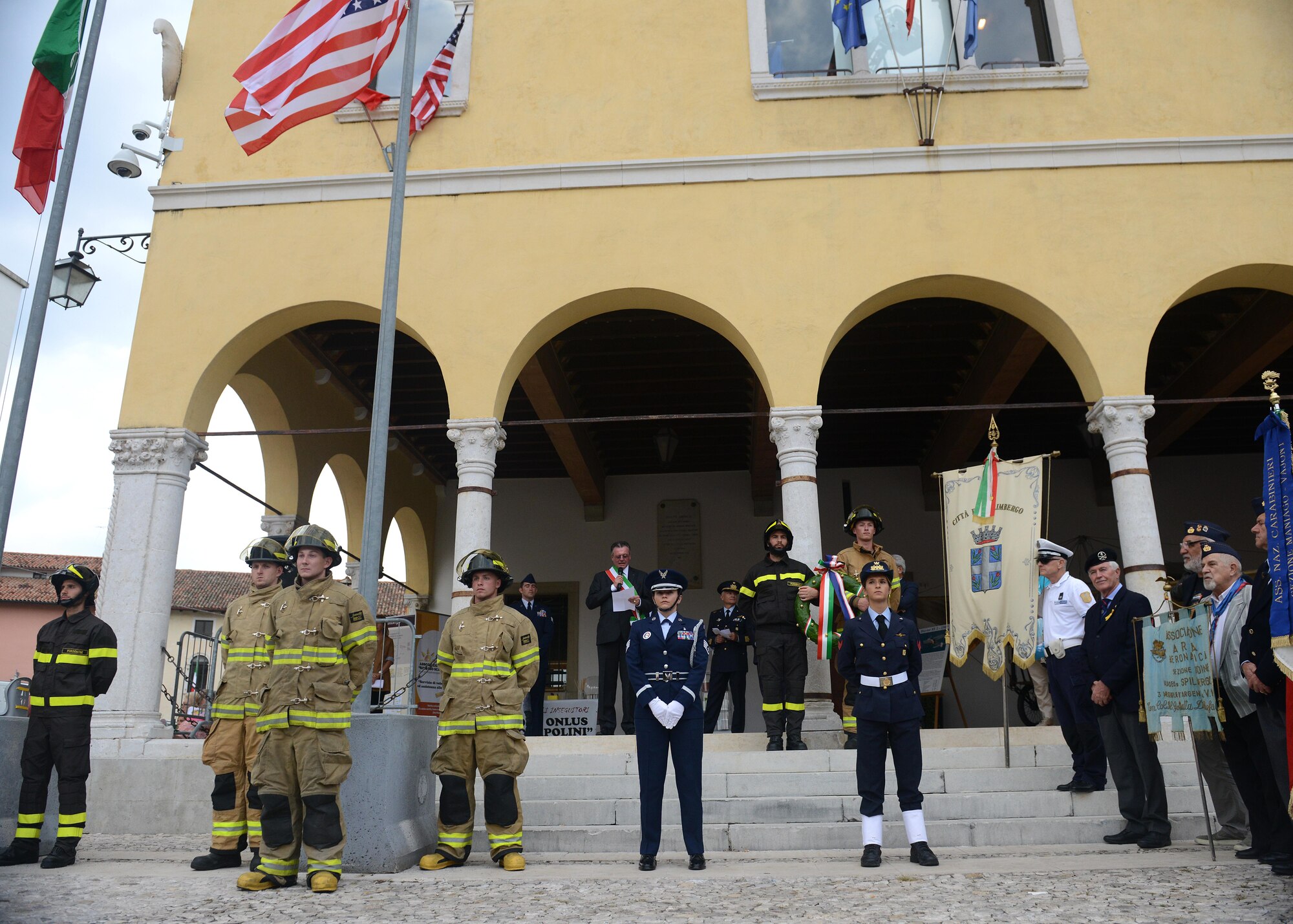 Italian and American participants stand during a ceremony at the 14th Annual Italian-American Friendship Festival, on Sept. 12, 2015, in Spilimbergo, Italy. The festival allowed Team Aviano an opportunity to strengthen bonds with their host nation community. The event also included several demonstrations, food, sports tournaments, music and a ceremony. (U.S. Air Force photo by  Staff Sgt. Evelyn Chavez/Released)