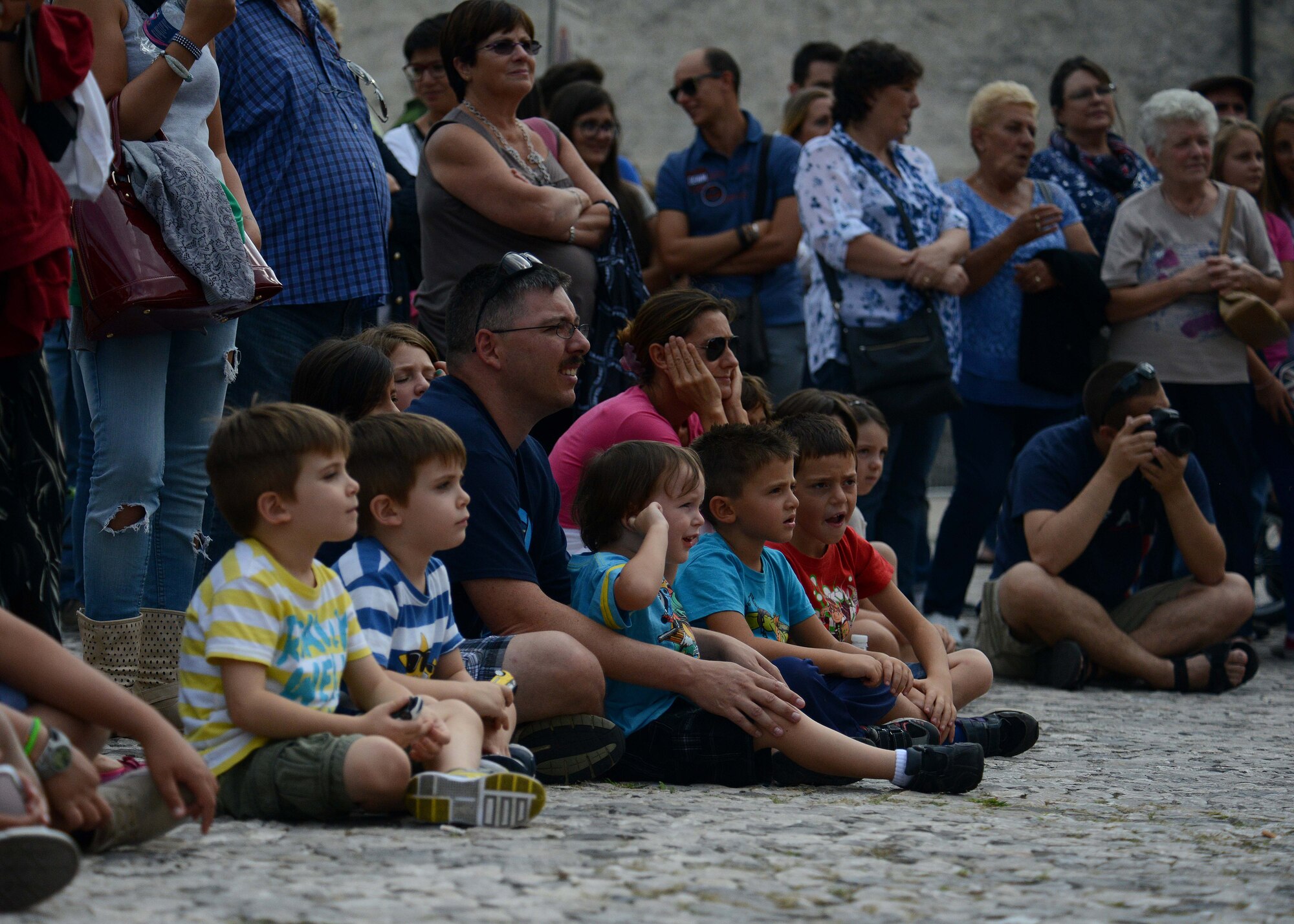 Spectators gather around a karate demonstration during the Italian-American Friendship Festival, on Sept. 12, 2015, in Spilimbergo, Italy.  The festival allowed Team Aviano an opportunity to strengthen bonds with their host nation community. The event also included several demonstrations, food, sports tournaments, music and a ceremony. (U.S. Air Force photo by  Staff Sgt. Evelyn Chavez/Released)
