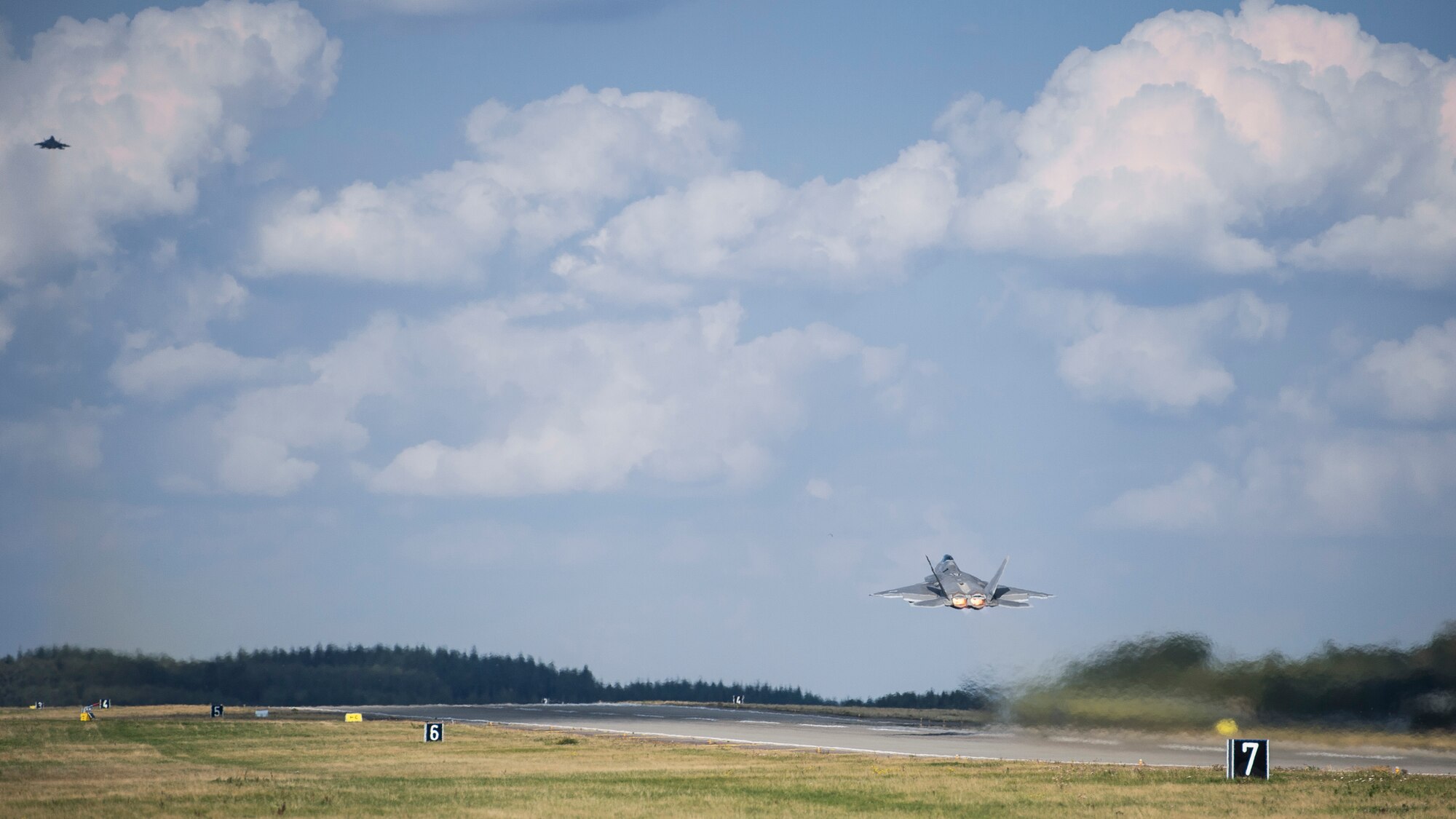 A U.S. Air Force F-22 Raptor fighter pilot assigned to the 95th Fighter Squadron at Tyndall Air Force Base, Fla., soars in the sky after taking off Sept. 11, 2015, at Spangdahlem Air Base, Germany. The deployment represented the inaugural F-22 training deployment to Europe and was funded by the European Reassurance Initiative, which is intended to increase the capability, readiness and responsiveness of NATO forces in part by funding rotational force presence in Eastern Europe. (U.S. Air Force photo by Staff Sgt. Christopher Ruano/Released)