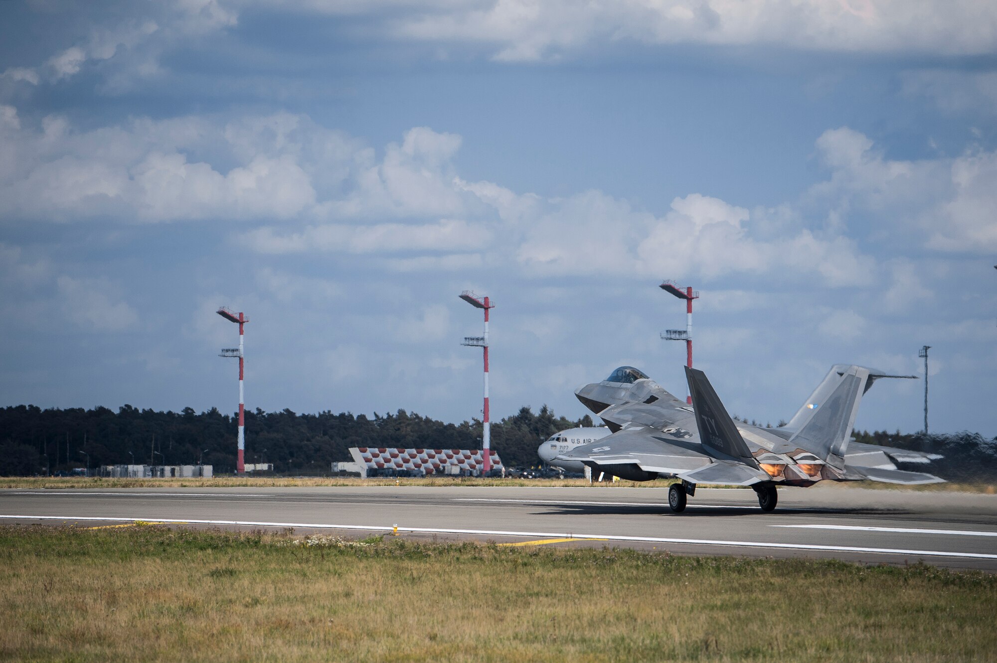A U.S. Air Force F-22 Raptor fighter pilot assigned to the 95th Fighter Squadron at Tyndall Air Force Base, Fla., takes off from the runway Sept. 11, 2015, at Spangdahlem Air Base, Germany. The deployment represented the inaugural F-22 training deployment to Europe and was funded by the European Reassurance Initiative, which is intended to increase the capability, readiness and responsiveness of NATO forces in part by funding rotational force presence in Eastern Europe. (U.S. Air Force photo by Staff Sgt. Christopher Ruano/Released)
