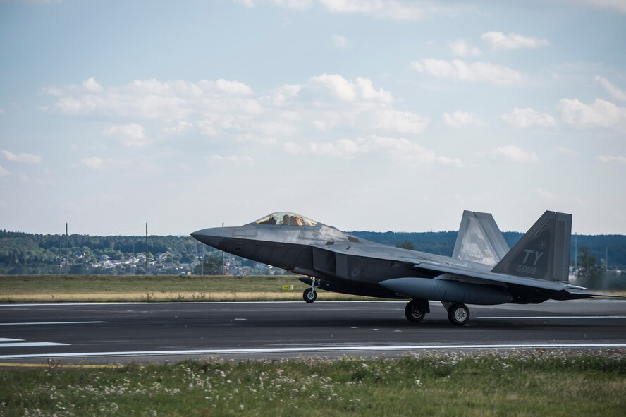 A U.S. Air Force F-22 Raptor fighter pilot assigned to the 95th Fighter Squadron at Tyndall Air Force Base, Fla., takes off from the runway Sept. 11, 2015, at Spangdahlem Air Base, Germany. The F-22s deployed from the 95th Fighter Squadron at Tyndall Air Force Base, Fla., as part of the European Reassurance Initiative and conducted air training with other Europe-based aircraft while demonstrating U.S. commitment to NATO allies and the security of Europe. (U.S. Air Force photo by Staff Sgt. Christopher Ruano/Released)