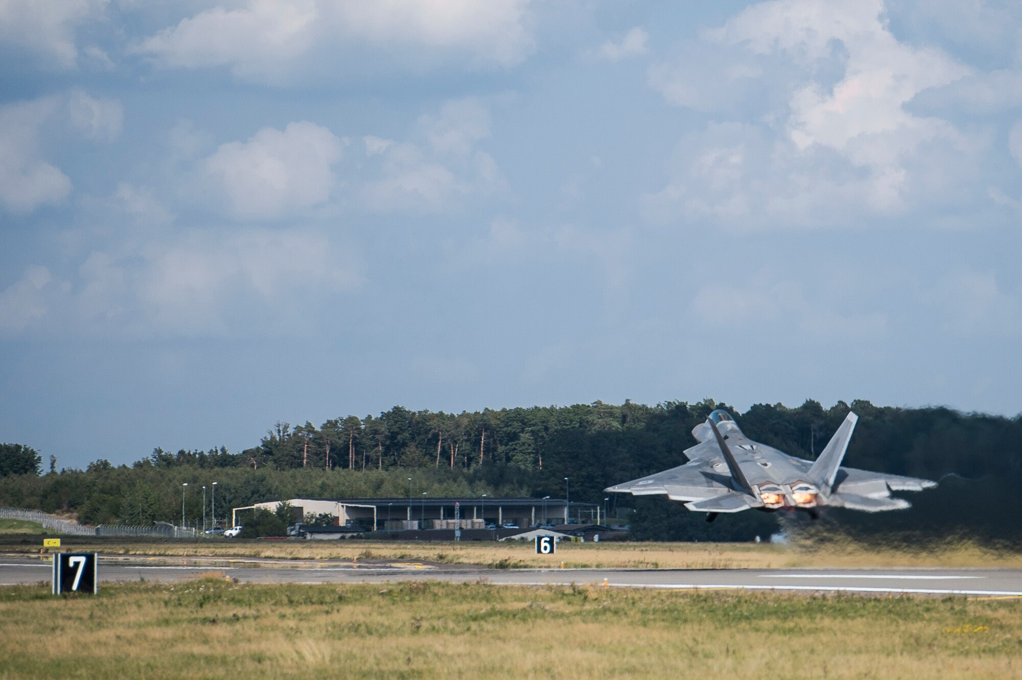 A U.S. Air Force F-22 Raptor fighter pilot assigned to the 95th Fighter Squadron at Tyndall Air Force Base, Fla., takes off from the runway Sept. 11, 2015, at Spangdahlem Air Base, Germany. The F-22s deployed from the 95th Fighter Squadron at Tyndall Air Force Base, Fla., as part of the European Reassurance Initiative and conducted air training with other Europe-based aircraft while demonstrating U.S. commitment to NATO allies and the security of Europe. (U.S. Air Force photo by Staff Sgt. Christopher Ruano/Released)
