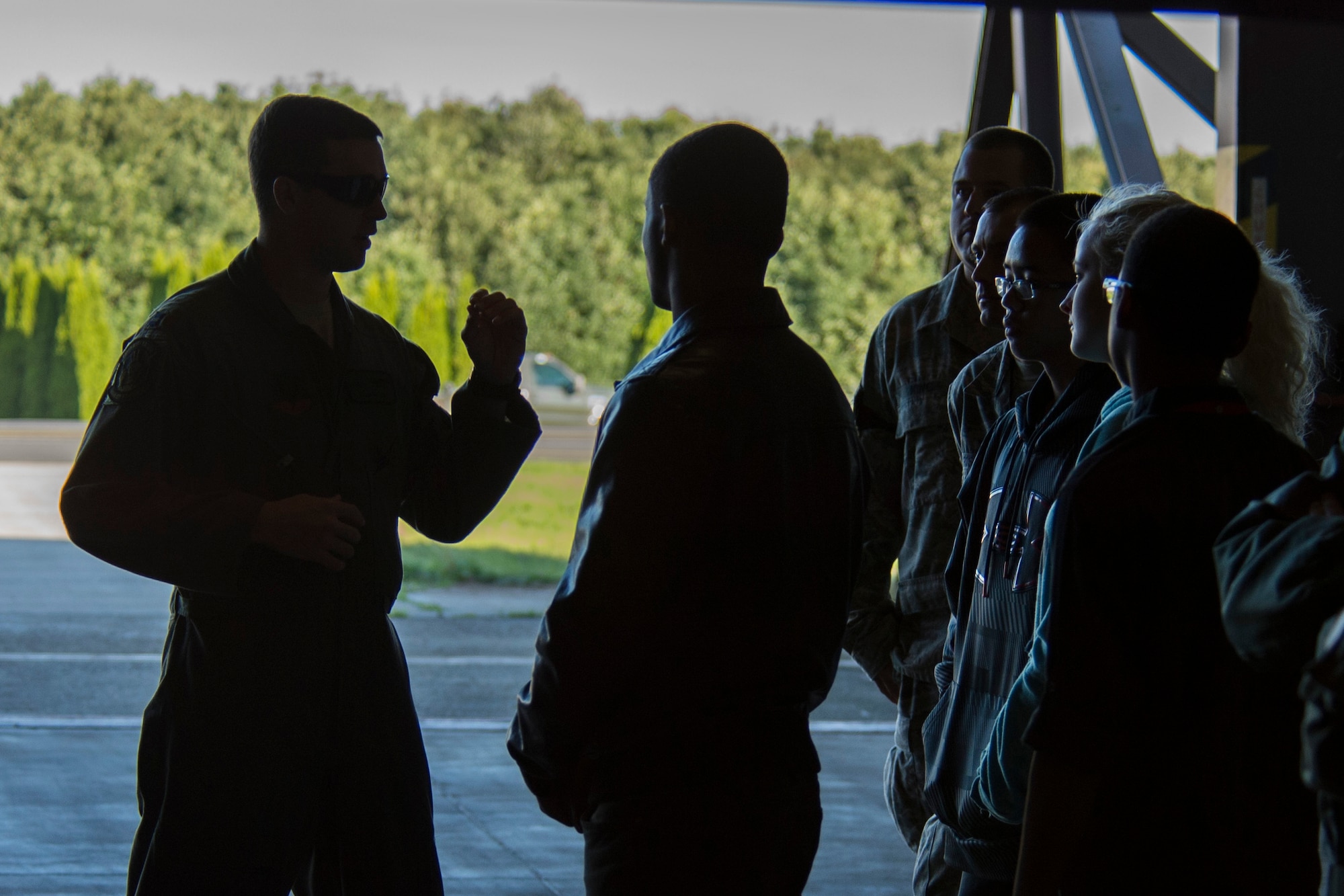 U.S. Air Force Capt. Michael Sayers, 95th Fighter Squadron F-22 Raptor fighter aircraft pilot, talks to a group of Junior ROTC members from Bitburg Middle-High School during a tour of an F-22 in a hardened aircraft shelter at Spangdahlem Air Base, Germany, Sept. 10, 2015. Sayers, along with other members of the 95th Fighter Squadron at Tyndall Air Force Base, Fla., were part of the first inaugural F-22 training deployment to Europe. (U.S. Air Force photo by Airman 1st Class Luke Kitterman/Released)
