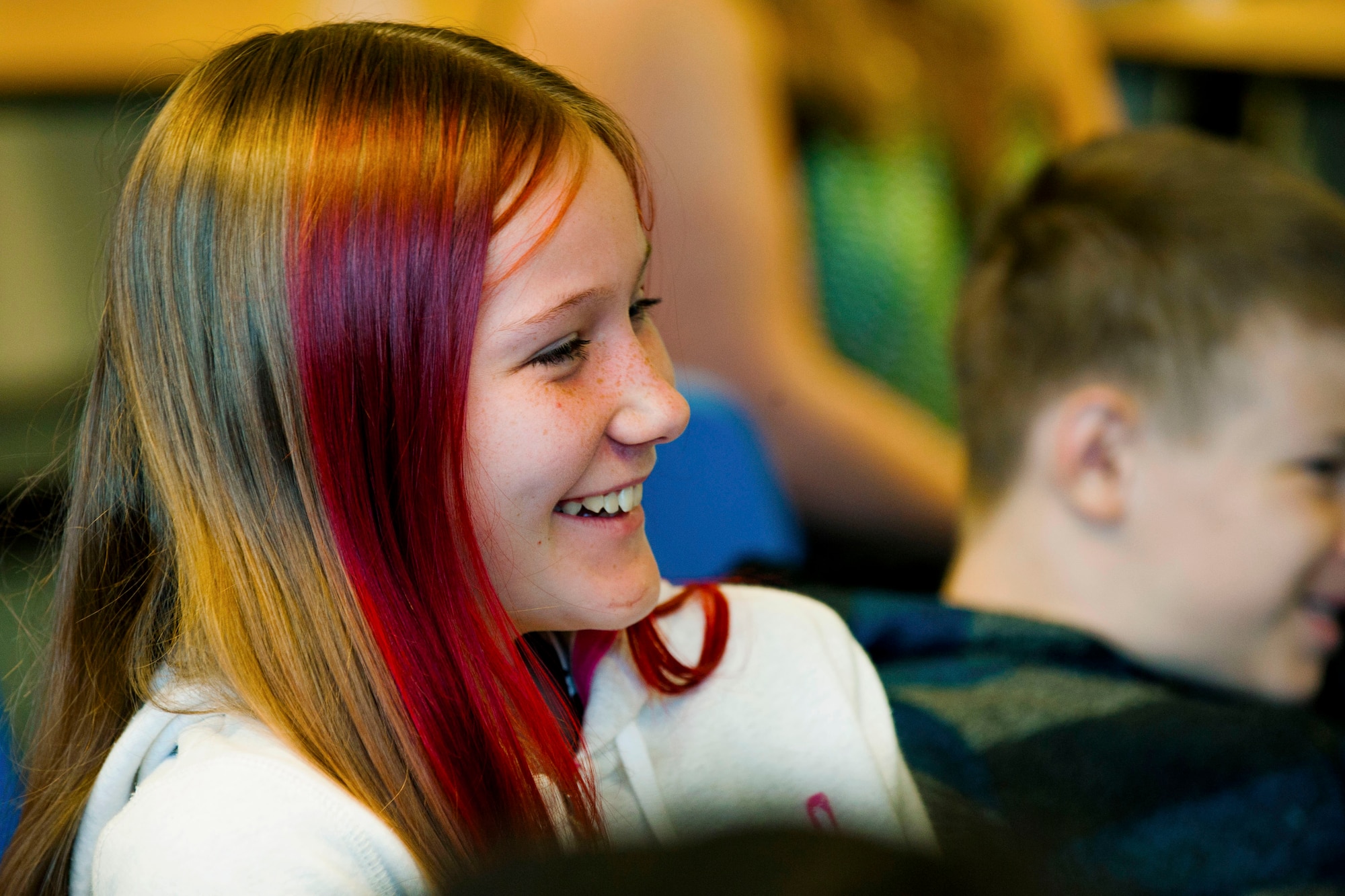 Regin Finley, Spangdahlem Middle School 8th-grader and daughter of Amy and U.S. Air Force Senior Master Sgt. Ryan Finley, 52nd Equipment Maintenance Squadron munitions material section chief, smiles during a visit on Spangdahlem Air Base, Germany, Sept. 9, 2015. Students ranging from 5th to 8th attended the 95th FS pilots’ visit. The 95th FS, from Tyndall Air Base, Fla., sent the F-22 Raptors to Spangdahlem on their first training mission to Europe as part of the European Reassurance Initiative, which provides support to NATO allies and partners in Europe. (U.S. Air Force photo by Airman 1st Class Timothy Kim/Released)