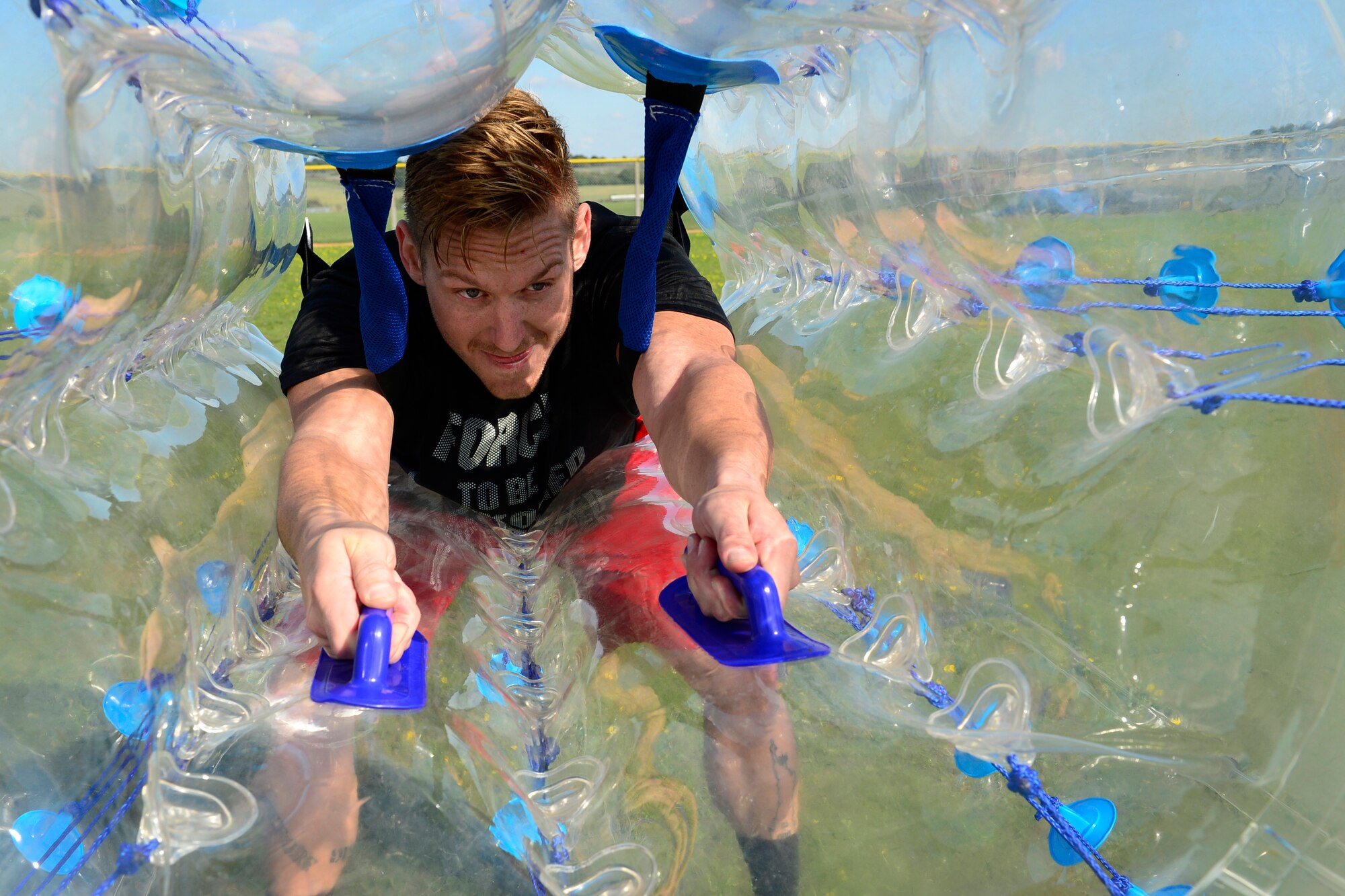 Senior Airman Jacob Swisher, 48th SFS criminal investigator, prepares for a round of Zorb soccer during the second annual Battle of the Badges at Royal Air Force Lakenheath, England, Sept. 10, 2015. The competition between the first responders of RAFs Lakenheath and Mildenhall is intended as an opportunity for them to remember and commemorate how first responders came together during the 9/11 attacks. (U.S. Air Force photo by Airman 1st Class Erin R. Babis/Released)