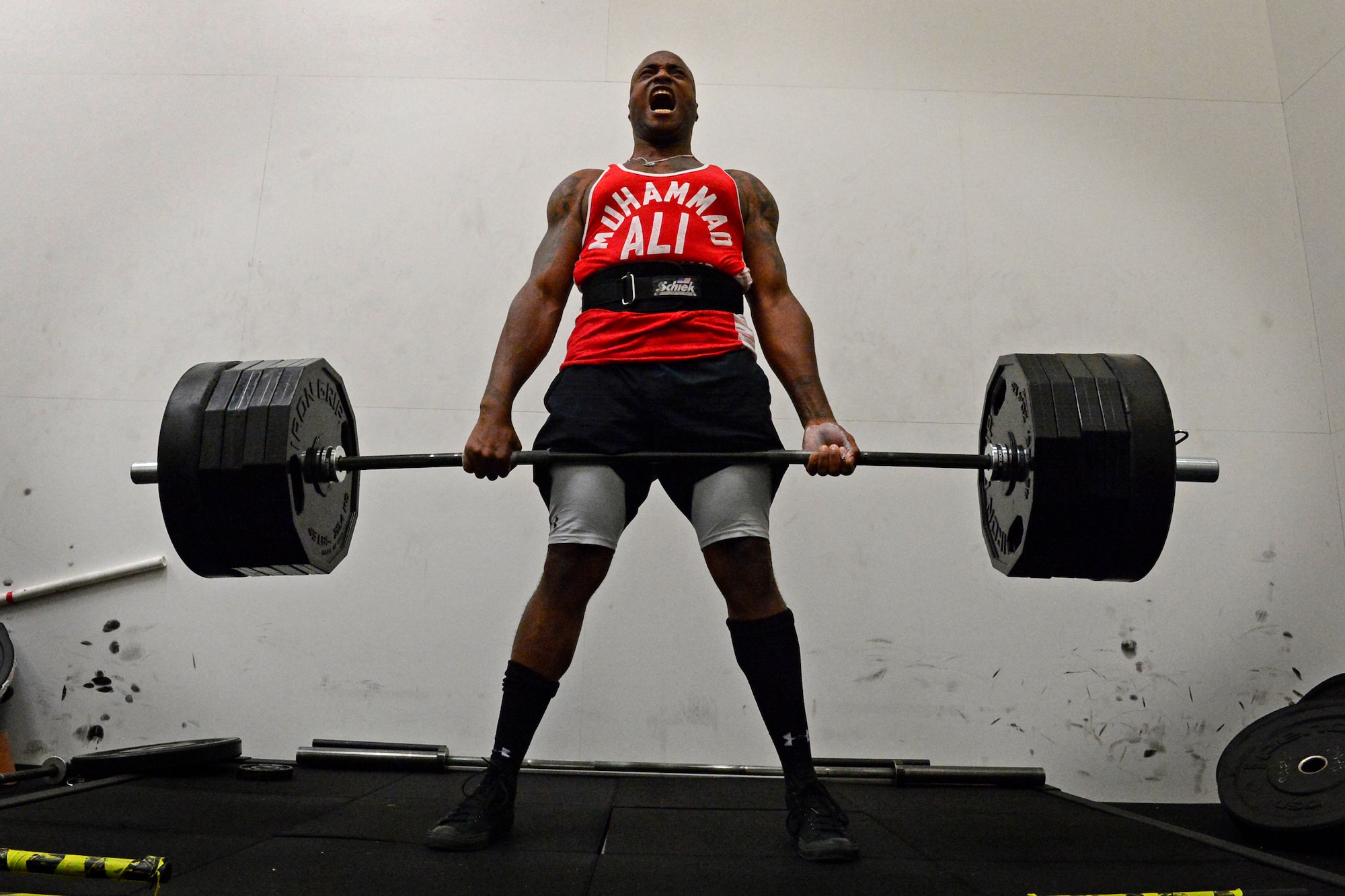 Staff Sgt. Derek White, 48th Civil Engineer Squadron firefighter, performs a deadlift during the second annual Battle of the Badges at Royal Air Force Lakenheath, England, Sept. 10, 2015. The competition between the first responders of RAFs Lakenheath and Mildenhall is intended as an opportunity for them to remember and commemorate how first responders came together during the 9/11 attacks. (U.S. Air Force photo by Airman 1st Class Erin R. Babis/Released)