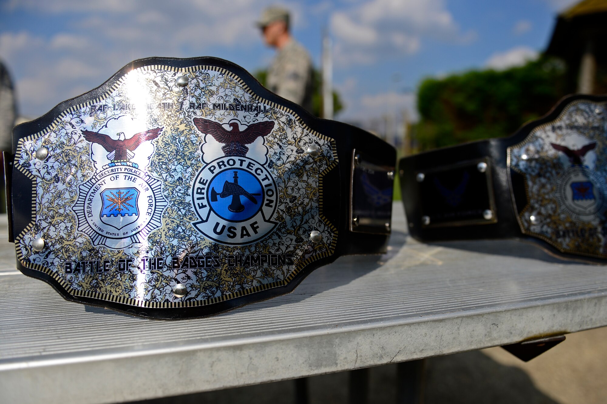 Trophy belts were awarded to Lakenheath security forces members and firefighters, the reigning champions of the second annual Battle of the Badges at Royal Air Force Lakenheath, England, Sept. 11, 2015. The competition between the first responders of RAFs Lakenheath and Mildenhall is intended as an opportunity for them to remember and commemorate how first responders came together during the 9/11 attacks. (U.S. Air Force photo by Airman 1st Class Erin R. Babis/Released)