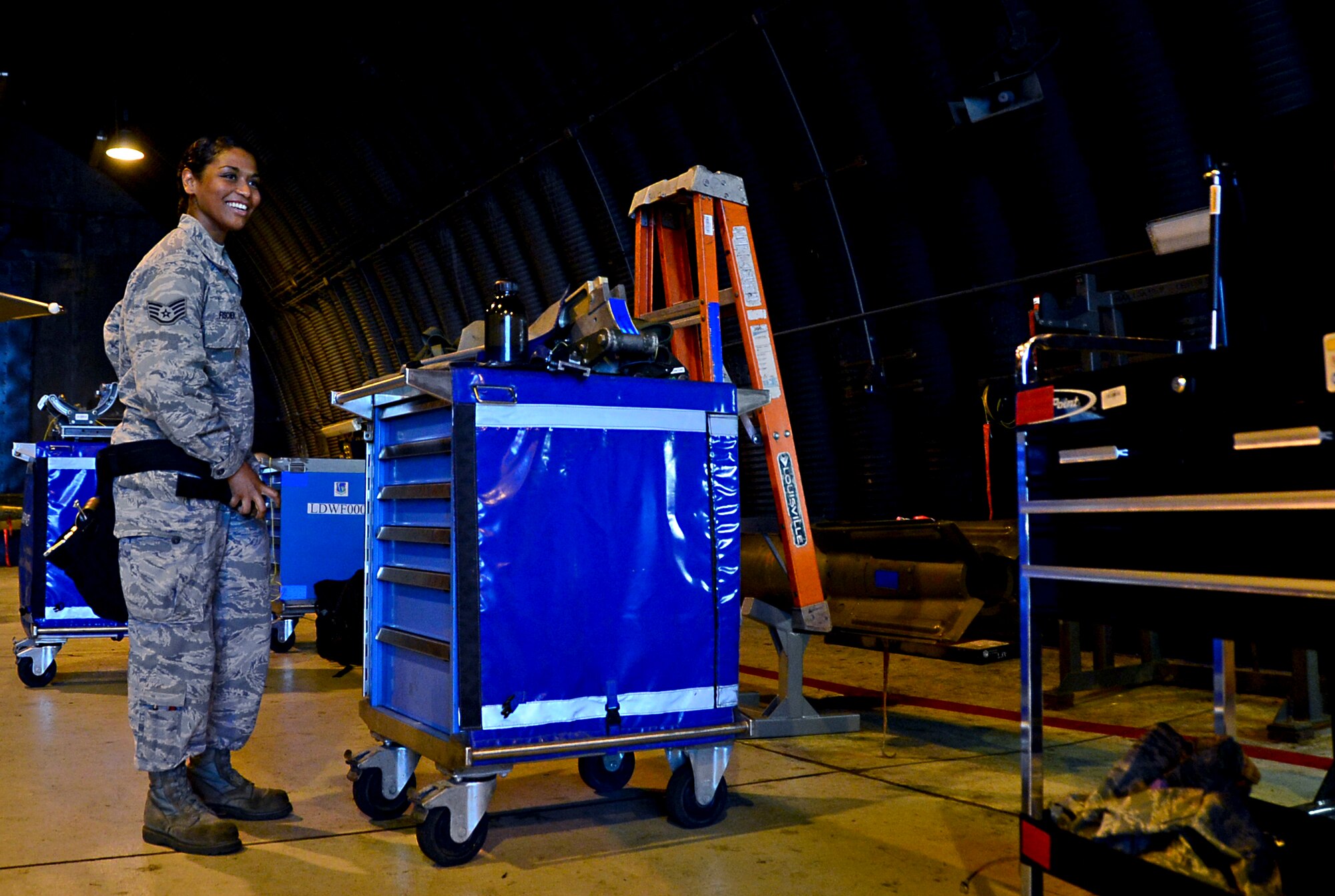 Staff Sgt. Jenean Fischer, 48th Aircraft Maintenance Squadron weapons load crew team chief, prepares for a weapons standardization evaluation at Royal Air Force Lakenheath, England, July 14, 2015. Every month, munitions Airmen are evaluated on their proficiency to become certified on any amount of munitions. (U.S. Air Force photo by Senior Airman Erin O’Shea/Released) 