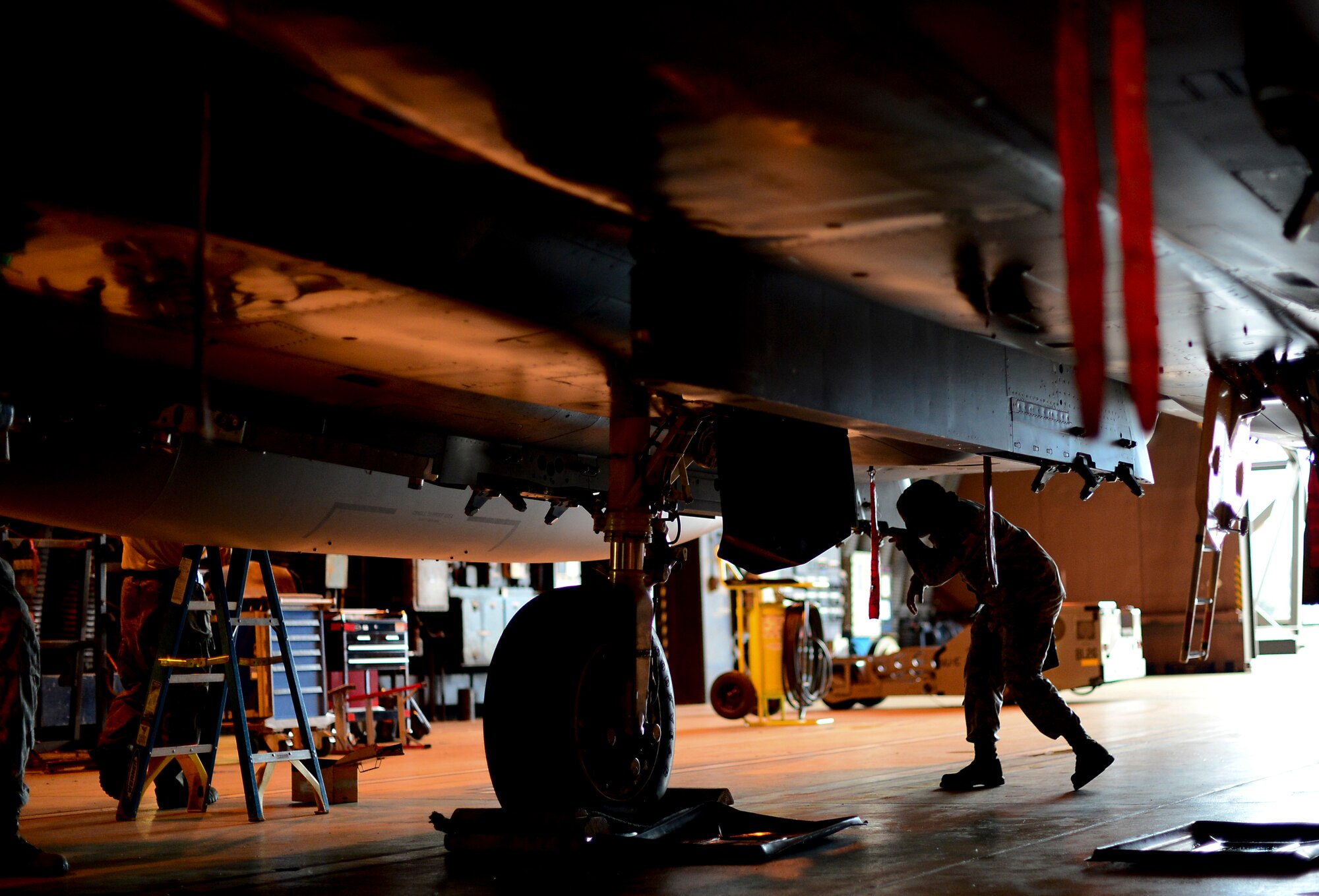 Staff Sgt. Jenean Fischer, 48th Aircraft Maintenance Squadron weapons load crew team chief, inspects a 494th Fighter Squadron F-15E Strike Eagle during a weapons standardization evaluation as a part of monthly training exercise at Royal Air Force Lakenheath, England, July 14, 2015. Weapons load crew Airmen are responsible for loading, unloading and preparing the placement of live munitions onto F-15E Strike Eagles assigned to the 48th Fighter Wing. (U.S. Air Force photo by Senior Airman Erin O’Shea/Released) 