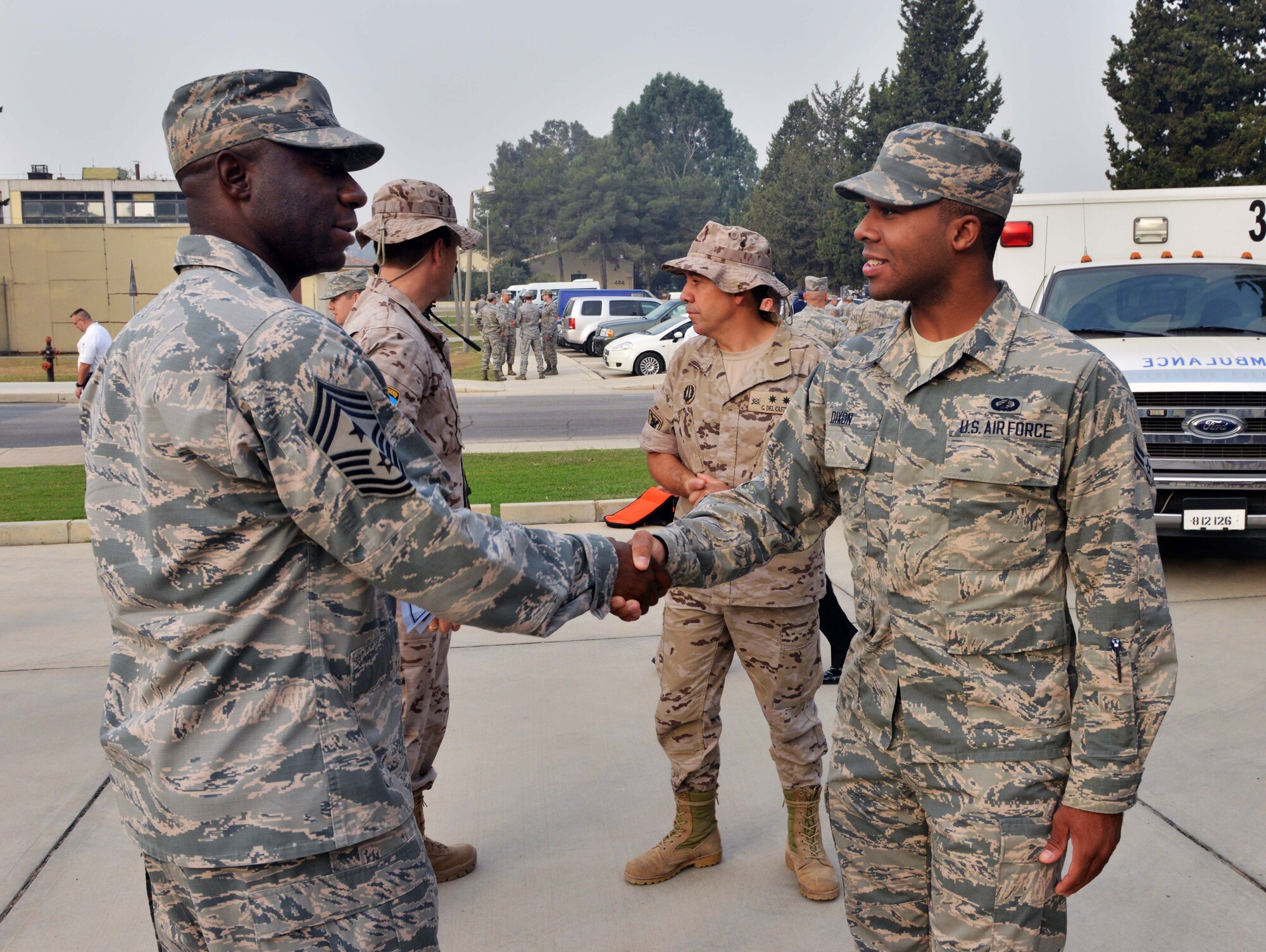 Chief Master Sgt. Vegas Clark, 39th Air Base Wing commander, greets Airman 1st Class Justin Dixon, 39th Comptroller Squadron customer service apprentice, upon meeting him for his chief shadow day Sept. 11, 2015, at Incirlik Air Base, Turkey. Bi-weekly, a member of Team Incirlik is chosen to follow Clark and learn what it’s like to be a command chief. (U.S. Air Force photo by Senior Airman Michael Battles/Released)