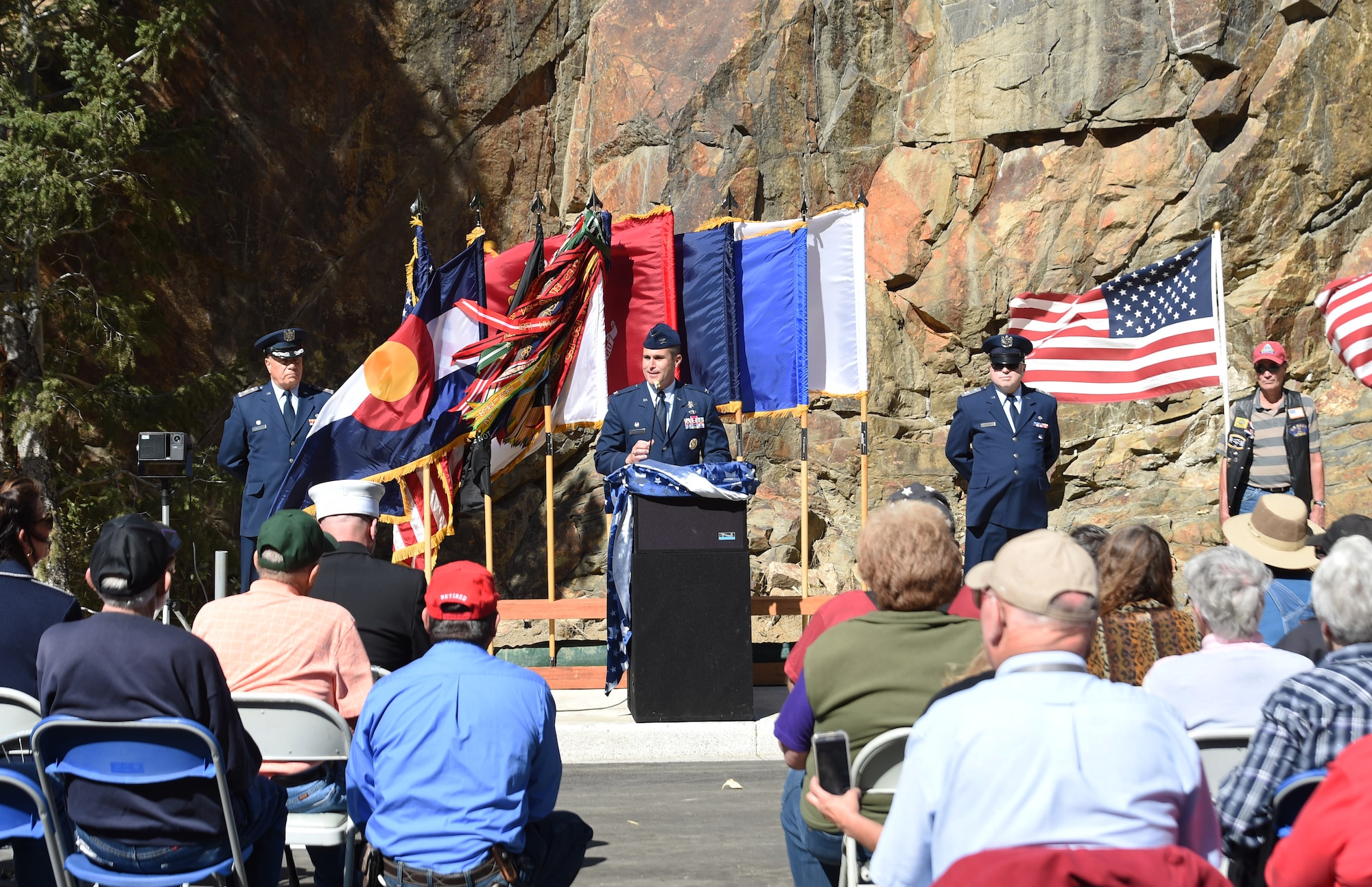 Col. John Wagner, 460th Space Wing commander, speaks to the audience during the I-70 Twin Tunnel re-naming ceremony Sept. 11, 2015, in Idaho Springs, Colo. Colorado State Legislature passed the bill in April 2015 to re-name the tunnels to recognize and remember the nation’s military veterans. (U.S. Air Force photo by Airman 1st Class Samantha Meadors/Released)