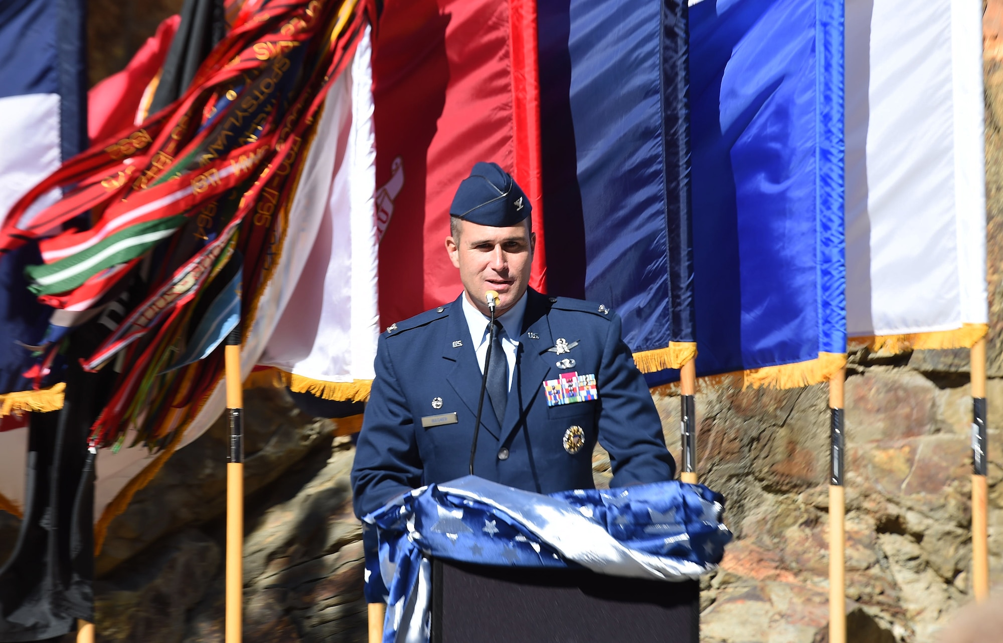 Col. John Wagner, 460th Space Wing commander, speaks to the audience during the I-70 Twin Tunnel re-naming ceremony Sept. 11, 2015, in Idaho Springs, Colo. Colorado State Legislature passed the bill in April 2015 to re-name the tunnels to recognize and remember the nation’s military veterans. (U.S. Air Force photo by Airman 1st Class Samantha Meadors/Released)