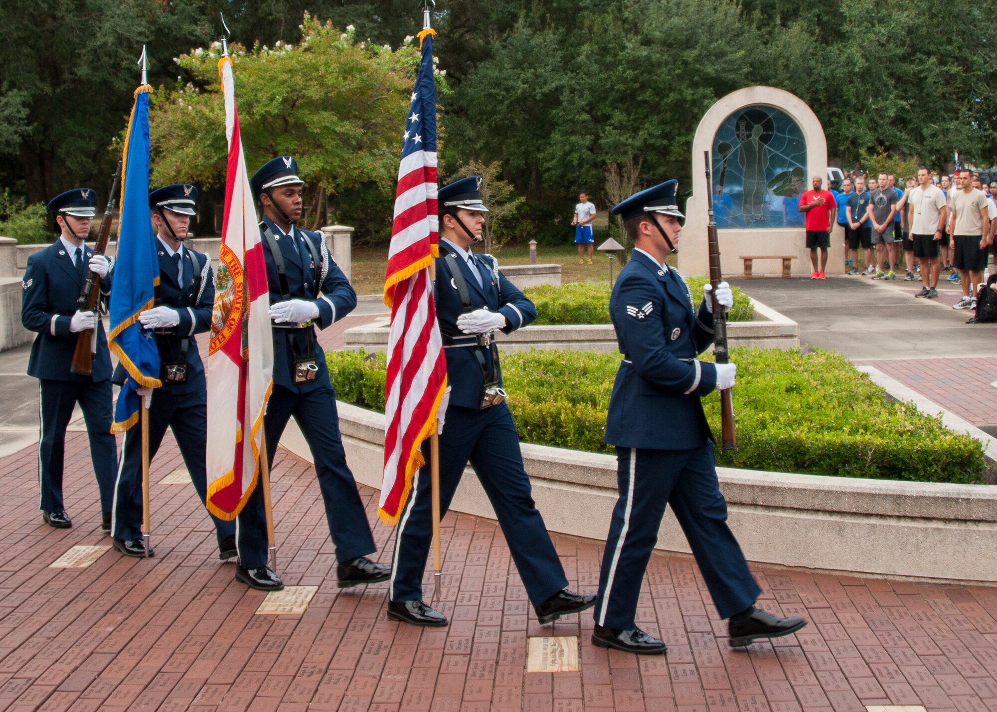 Eglin’s Honor Guard retires the colors before the 9/11 Memorial 3-Mile Run/Walk at the All Wars Memorial at Eglin Air Force Base, Fla. Sept. 11. More than 535 runners participated in the run to remember the events of 9/11. (U.S. Air Force photo/Ilka Cole)