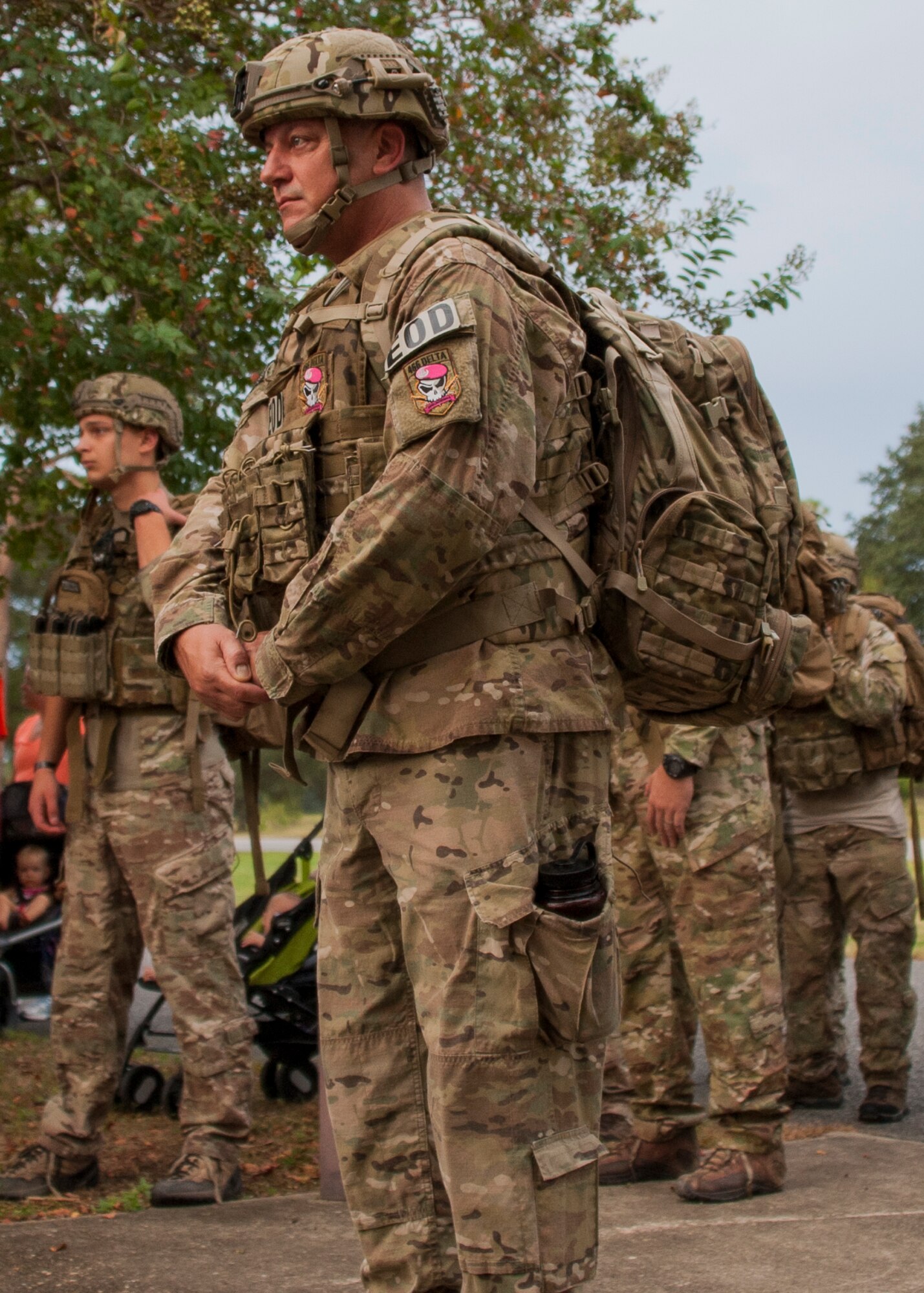 Service members listen to brief welcome statements before the 9/11 Memorial 3-Mile Run/Walk at the All Wars Memorial at Eglin Air Force Base, Fla. Sept. 11. More than 535 runners participated in the run to remember the events of 9/11. (U.S. Air Force photo/Ilka Cole)