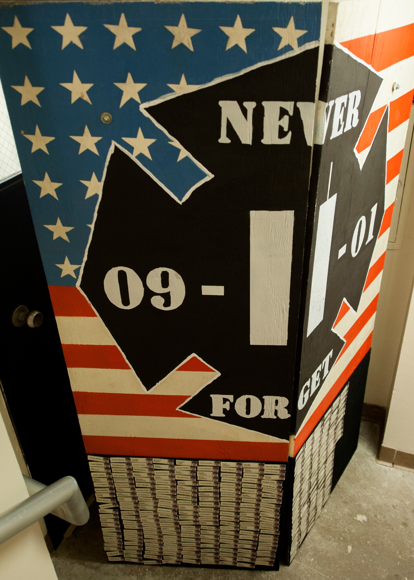 The 96th Civil Engineer Squadron’s fire department commemorative display board shows  name tags for fallen firefighters during the annual 9/11 memorial tower climb at Eglin Air Force Base, Fla. Sept. 11. Approximately 45 firefighters climbed 13 flights of steps with a name tag for each of the 343 firefighters who lost their lives 14 years ago. After reaching the top of the air traffic control tower, each name was recited and attached to a commemorative display board. The event closed with traditional bell rings and pauses between each ring to honor the 9/11 heroes. (U.S. Air Force photo/Ilka Cole)