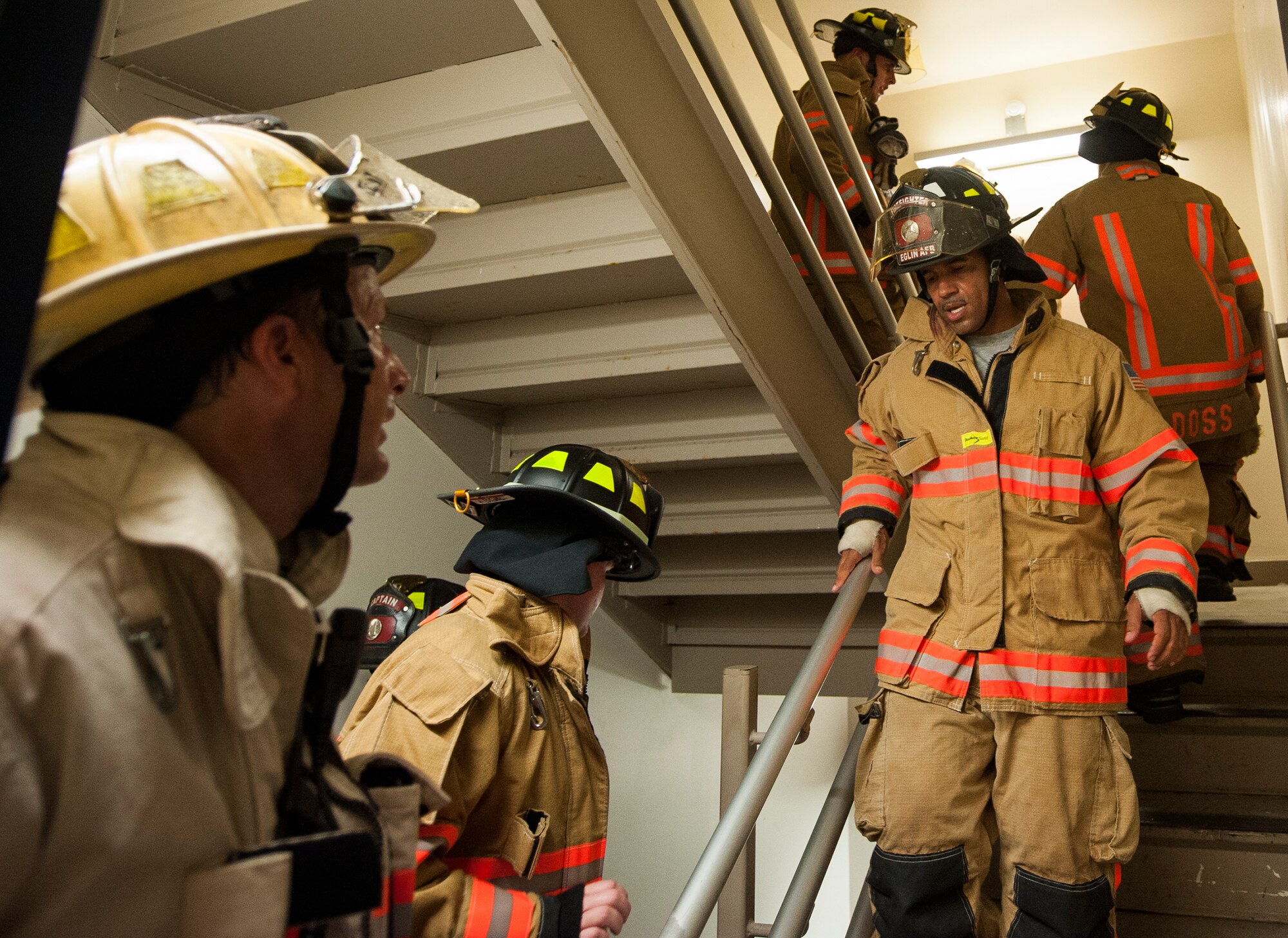 Firefighters from the 96th Civil Engineer Squadron, climb up and down the air traffic control tower during the annual 9/11 memorial tower climb at Eglin Air Force Base, Fla. Sept. 11.  
Approximately 45 firefighters climbed 13 flights of steps with a name tag for each of the 343 firefighters who lost their lives 14 years ago. After reaching the top of the air traffic control tower, each name was recited and attached to a commemorative display board. The event closed with traditional bell rings and pauses between each ring to honor the 9/11 heroes. (U.S. Air Force photo/Ilka Cole)