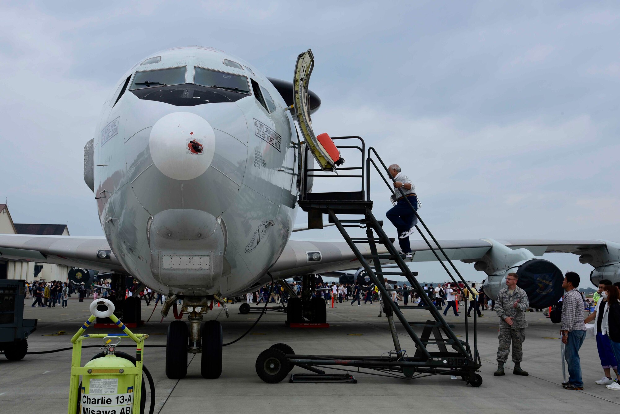 A Misawa Air Festival attendee climbs into an E-3 Sentry at Misawa Air Base, Japan, Sept. 13, 2015. This aircraft is an airborne warning and control system used for surveillance, target detection and tracking. (U.S. Air Force photo by Airman 1st Class Jordyn Fetter/Released)