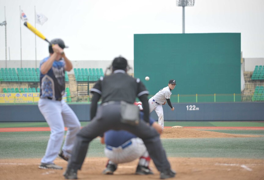 A member of the Gunsan City All-Star team pitches the ball during the American-Korean baseball game at the Wolmyong Stadium, Gunsan City, Republic of Korea, September 12, 2015. These games highlight the lasting friendship on the peninsula and to experience each other’s cultures as they operate as a team. The game’s final score was 29 to 1, with America taking the win. (U.S. Air Force photo by Master Sergeant David Miller/Released)