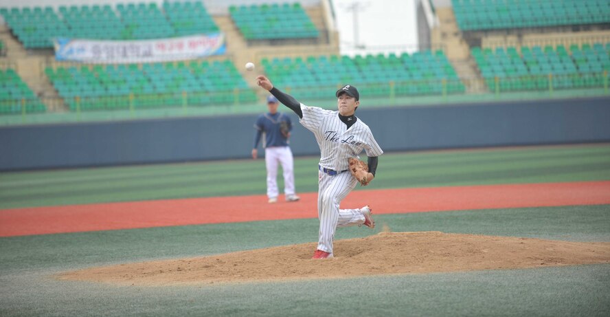 A member of the Gunsan City All-Star team pitches the ball during the American-Korean baseball game at the Wolmyong Stadium, Gunsan City, Republic of Korea, September 12, 2015. These games highlight the lasting friendship on the peninsula and to experience each other’s cultures as they operate as a team. The game’s final score was 29 to 1, with America taking the win. (U.S. Air Force photo by Master Sergeant David Miller/Released)