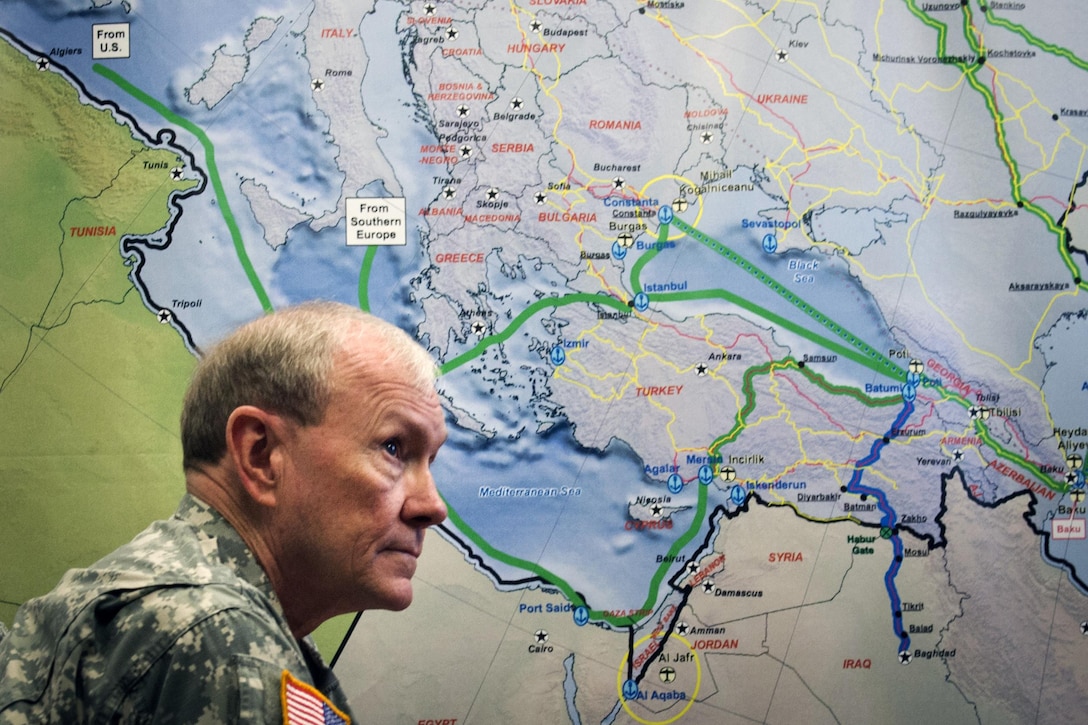 Army Gen. Martin E. Dempsey, chairman of the Joint Chiefs of Staff, receives a briefing on the U.S. Army Military Surface Deployment and Distribution Command's current mission while visiting Scott Air Force Base, Ill., June 19, 2013. DoD photo by D. Myles Cullen