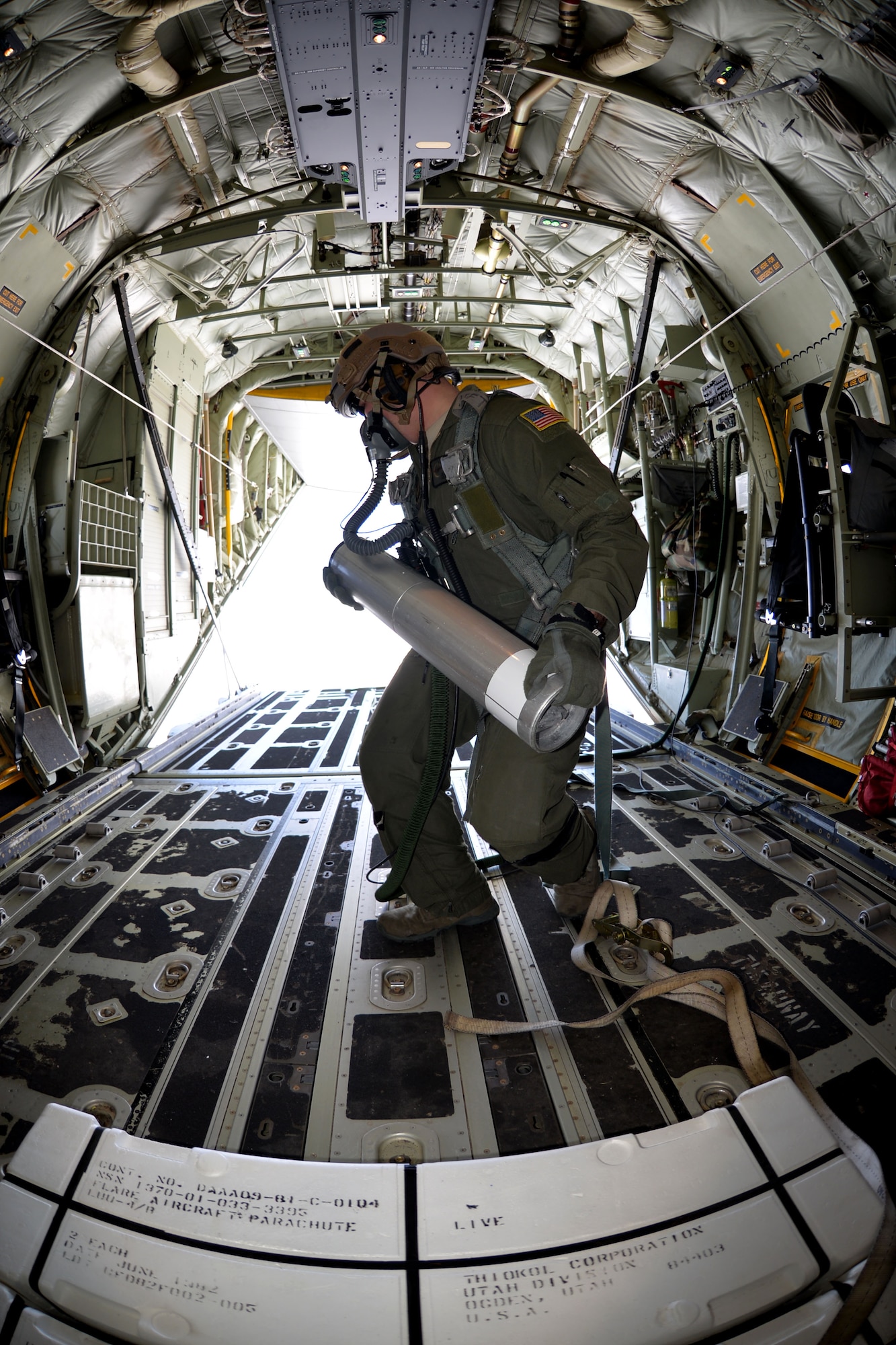 U.S. Air Force Senior Airman Jeremie Anderson, 67th Special Operations Squadron MC-130J Commando II loadmaster, prepares to drop an LUU-4/B flare during a training mission Sept. 8, 2015, over the North Sea. Anderson tossed the flares from the back of the aircraft for 48th Fighter Wing F-15 pilots to track, target and destroy. The 67th SOS and the 48th FW organized the two-day mission in order to provide realistic targeting training for F-15 pilots. Although the primary use of the flares are for search and rescue missions, instead they were used for targeting practice due to an upcoming expiration date. (U.S. Air Force photo by Tech. Sgt. Austin May/Released)
9/11/2015 - U.S. Air Force Senior Airman Jeremie Anderson, 67th Special Operations Squadron MC-130J Commando II loadmaster, prepares an LUU-4/B flare to be dropped during a training mission Sept. 8, 2015, over the North Sea. Anderson tossed the flares from the back of the aircraft for 48th Fighter Wing F-15 pilots to track, target and destroy. The 67th SOS and the 48th FW organized the two-day mission in order to provide realistic targeting training for F-15 pilots. Although the primary use of the flares are for search and rescue missions, instead they were used for targeting practice due to an upcoming expiration date. (U.S. Air Force photo by Tech. Sgt. Austin May/Released)