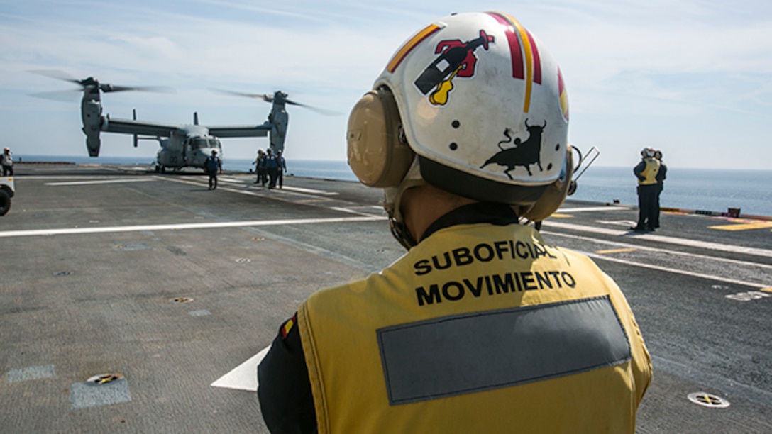 An MV-22B Osprey practiced landing on the Spanish amphibious assault ship Juan Carlos I (L-61) during deck landing qualifications, Sept. 9 near the coast of Spain. The DLQs are part of the Allied Maritime Basing Initiative, which seeks to provide the U.S. and allies with a year-round maritime-based crisis response force in the Mediterranean Sea or the Gulf of Guinea by leveraging the significant amphibious capabilities already residing in Europe.