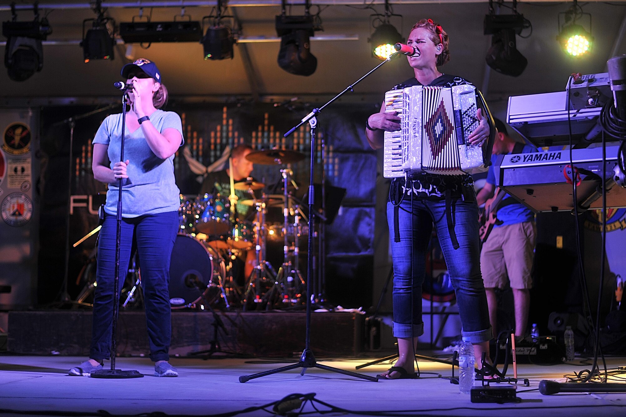 Senior Airman Melissa Lackore and Staff Sgt. Michelle Hooper, Air Forces Central Command band members, perform for service members at an undisclosed location in Southwest Asia, Aug. 27, 2015. The AFCENT band is charged with keeping spirits high in the Central Command Area of Responsibility. (U.S. Air Force photo by Staff Sgt. Emerson Nuñez/Released)
