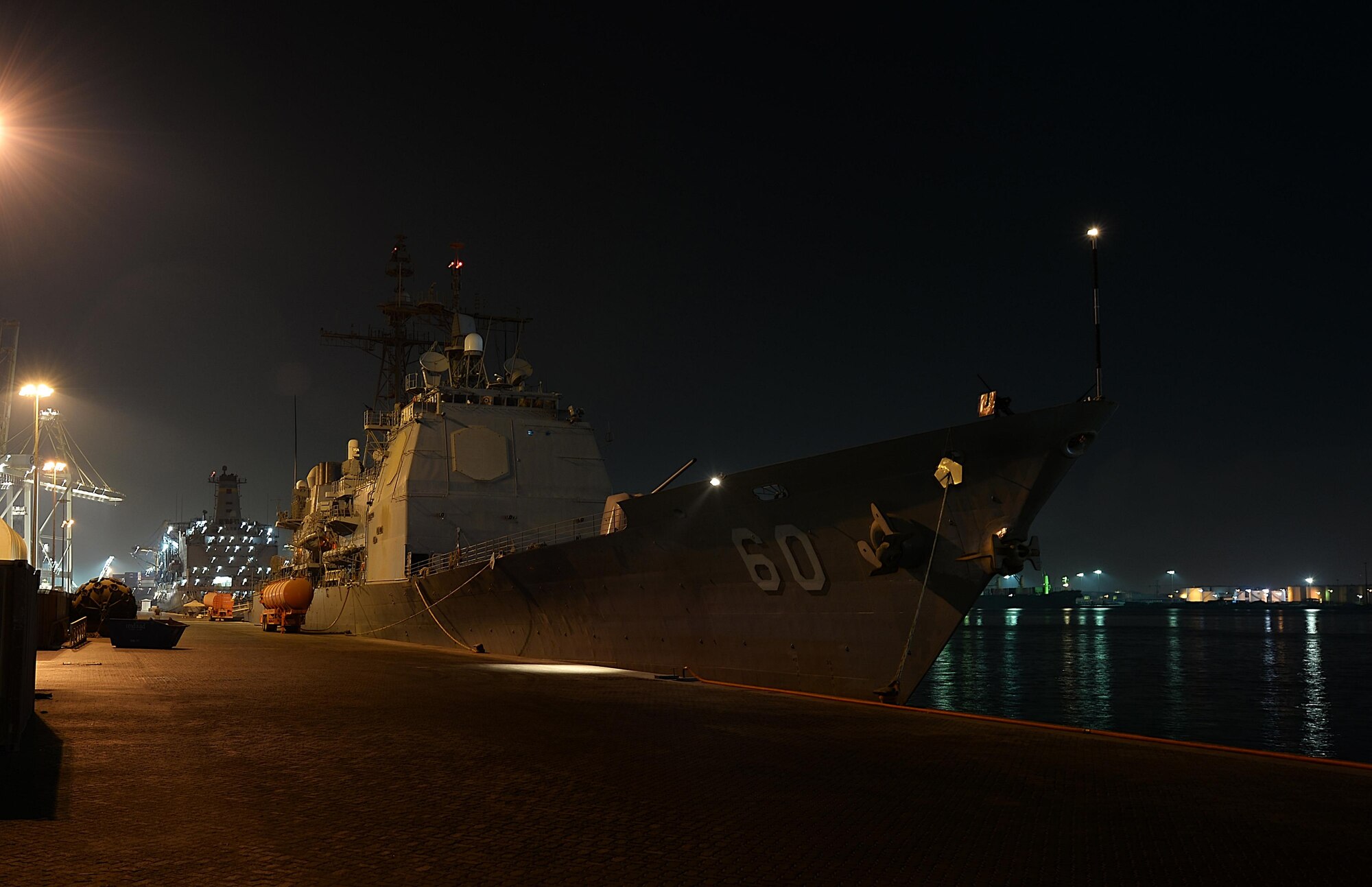 Guided-missile cruiser USS Normandy (CG 60) sits at port at an undisclosed location in Southwest Asia, Aug. 27, 2015. Sailors of the USS Normandy anchored in Southwest Asia as part of their 2015 deployment. (U.S. Air Force photo by Staff Sgt. Emerson Nuñez/Released)

