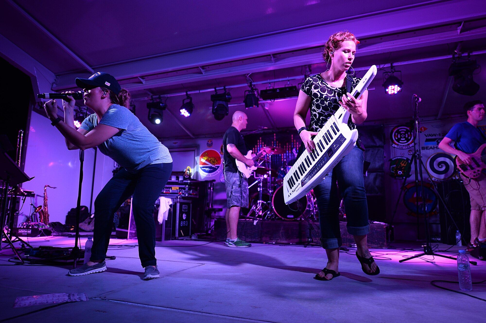 Senior Airman Melissa Lackore, left, and Staff Sgt. Michelle Hooper, Air Forces Central Command band members perform for service members at an undisclosed location in Southwest Asia, Aug. 27, 2015. The AFCENT band plays a wide variety of genres to accommodate different types of performances for different types of events. (U.S. Air Force photo by Staff Sgt. Emerson Nuñez/Released)
