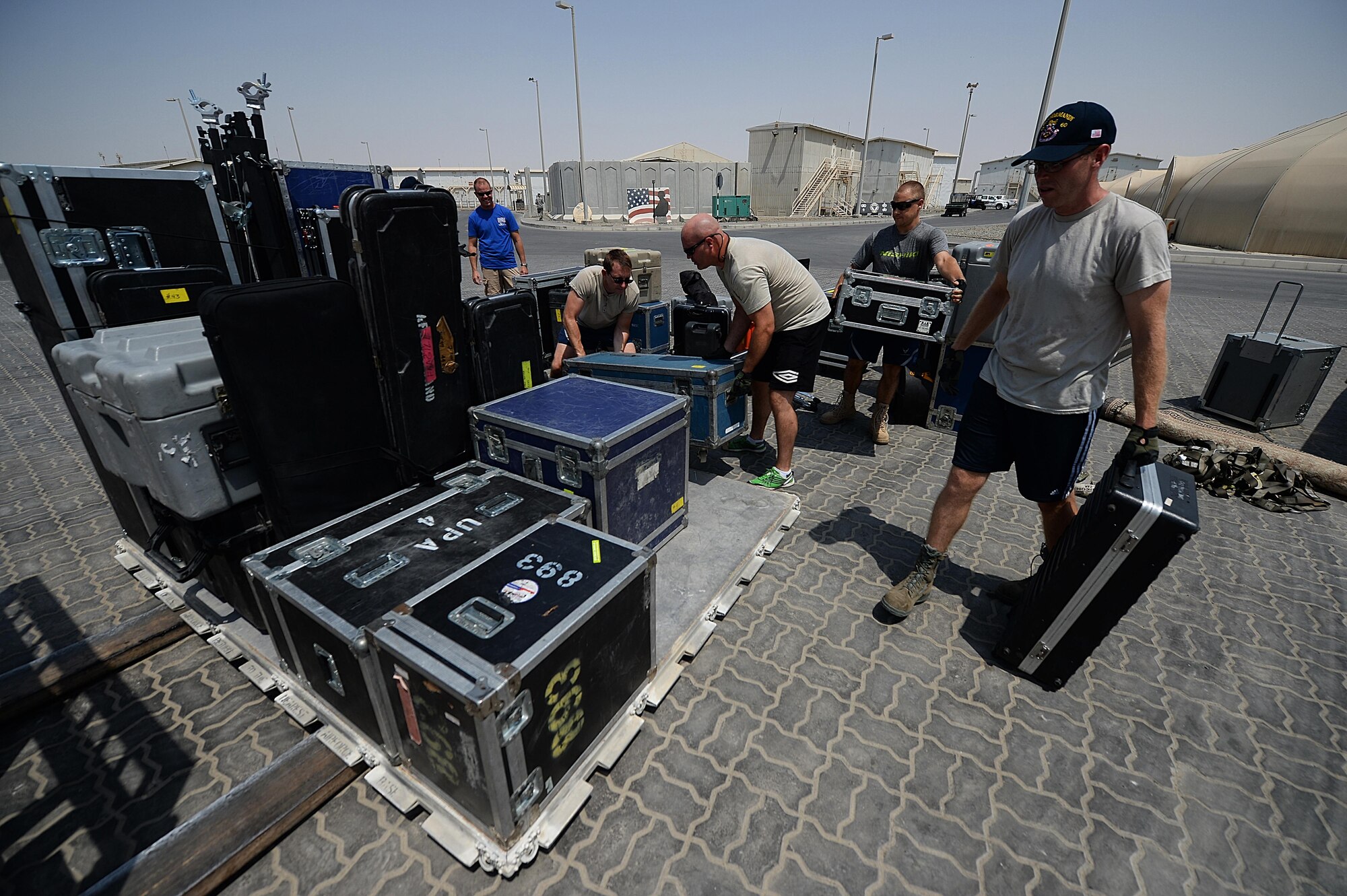 After performing a variety of shows downrange, members of the Air Forces Central Command band palletize their equipment for transportation at an undisclosed location in Southwest Asia, Sept. 1, 2015. Band members palletize, load and set up their own equipment. (U.S. Air Force photo by Staff Sgt. Emerson Nuñez/Released)
