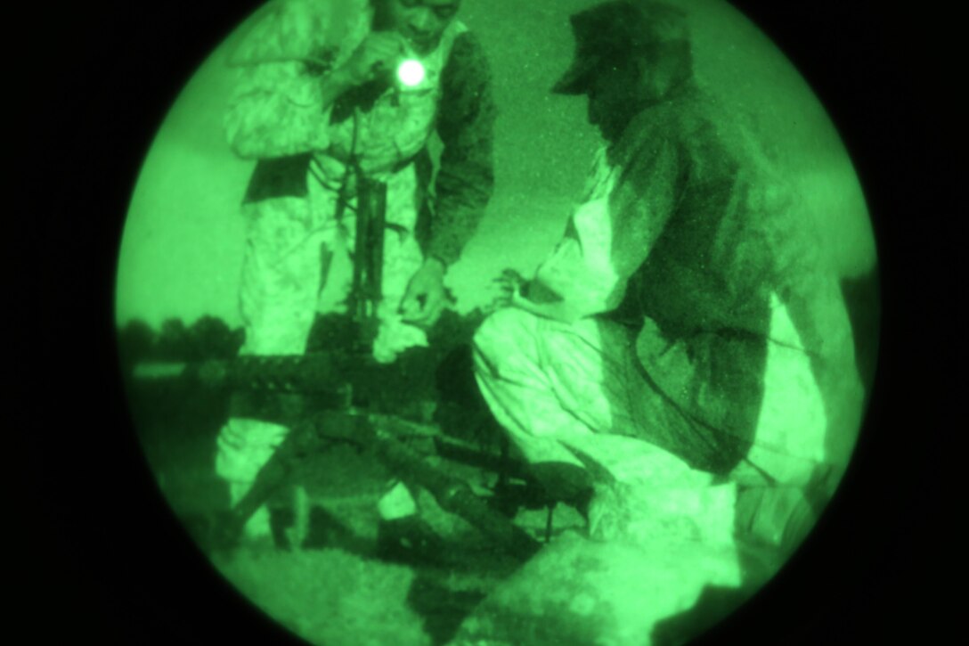 Marines conduct a functions check for a Browning M2 .50-caliber machine gun prior to a weapons familiarization range at Marine Corps Base Camp Lejeune, North Carolina, Aug. 27, 2015. More than 100 Marines from Marine Air Support Squadron 1 honed their weapons skills with the M240B machine gun, Browning M2 .50-caliber machine gun and the M1014 combat shotgun. Marines from various military job specialties received hands-on experience that allowed them to improve crucial skills and become well-rounded war fighters. (U.S. Marine Corps photo by Cpl. N.W. Huertas/ Released)