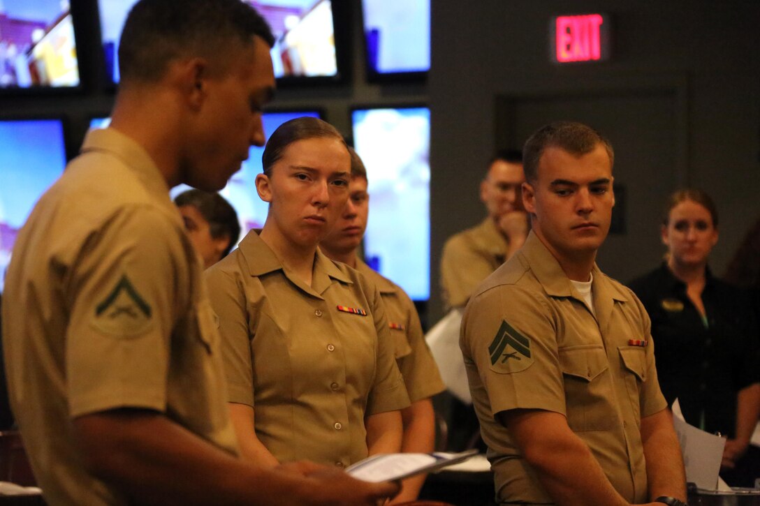 Marines listen to letters from witnesses during a 9/11 Memorial Service at Marine Corps Air Station Cherry Point, N.C., Sept. 11, 2015. Marines gather every September 11 to honor the fallen men and women of this tragic event in American history. Many remember what it was like to turn on the news and witness ash and debris cascade over New York City’s streets as bystanders scattered to safety. Marines endure vigorous and precise training to ensure they are proficient and always ready to protect their nation’s safety. (U.S. Marine Corps photo by Cpl. N.W. Huertas/Released)