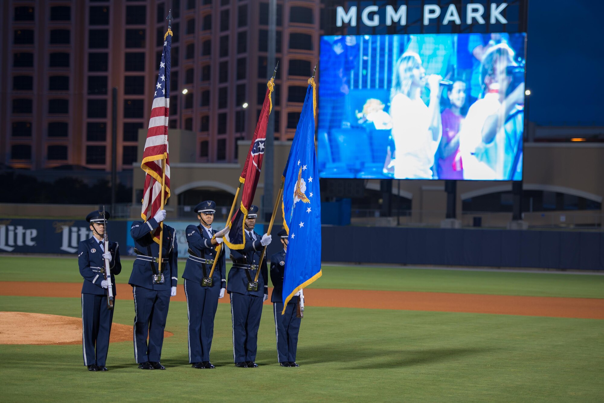 Members of the Keesler Air Force Base Honor Guard post the colors during a remembrance ceremony at the Biloxi Shuckers Minor League Baseball game Sept. 11, 2015, at MGM Park, Biloxi, Miss. The event honored those who lost their lives during the 9/11 attacks. It also included first pitches by a member of the local police department, fire department, each military service branch,  a 21-gun salute and the playing of taps by the Keesler Honor Guard. (U.S. Air Force photo by Marie Floyd)